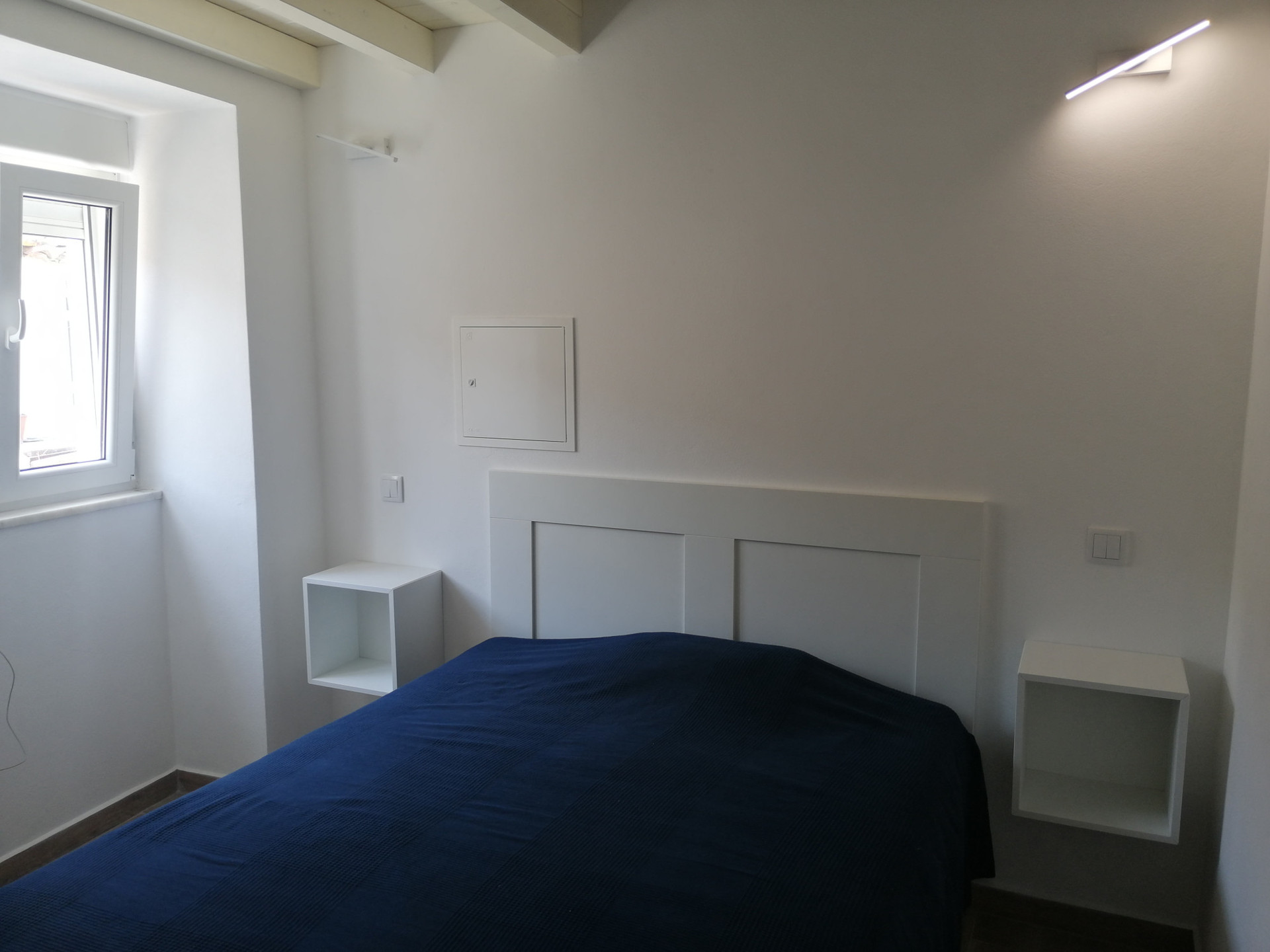 Bedroom with blue bedding