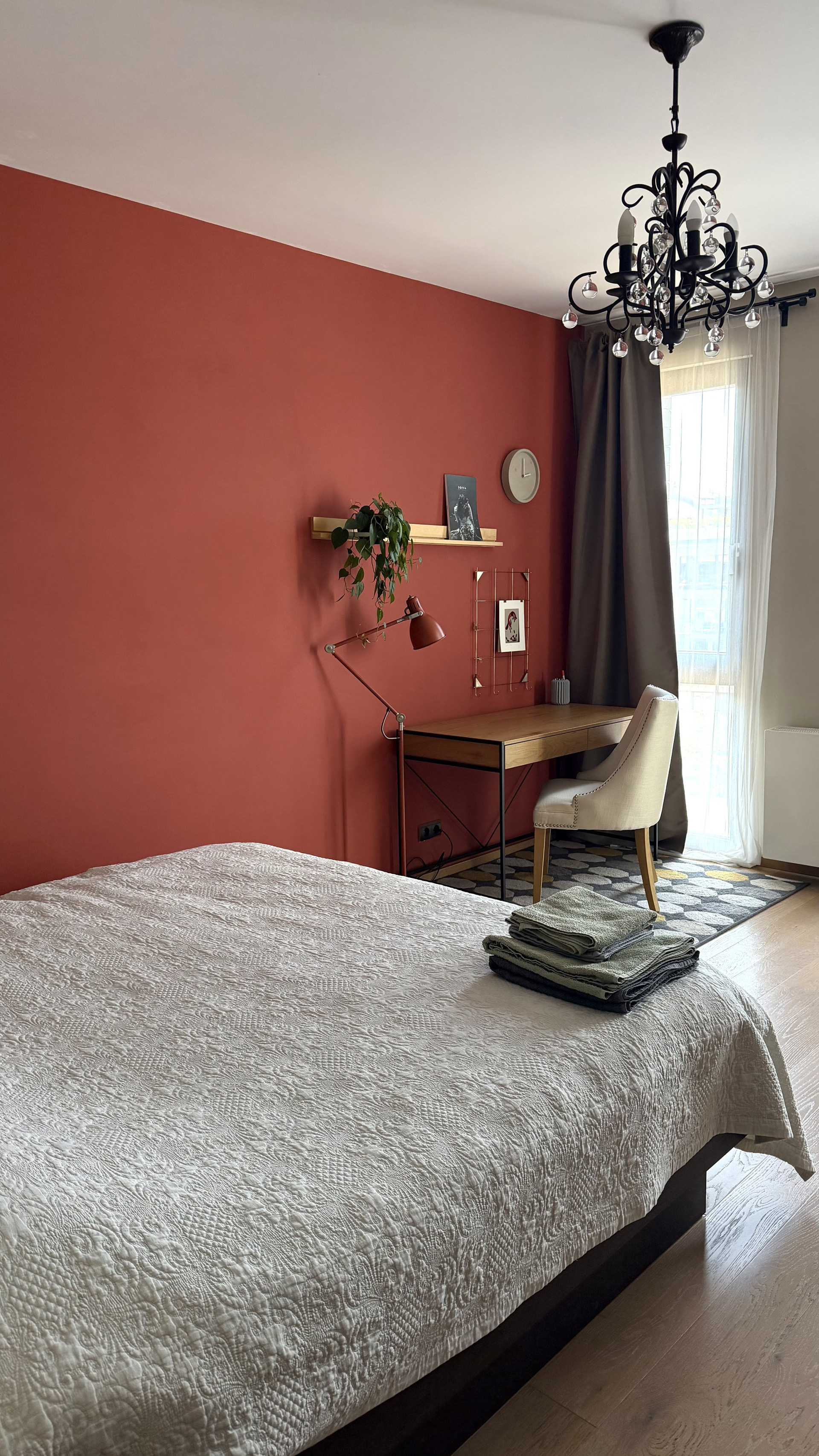 Bedroom with desk red accent wall