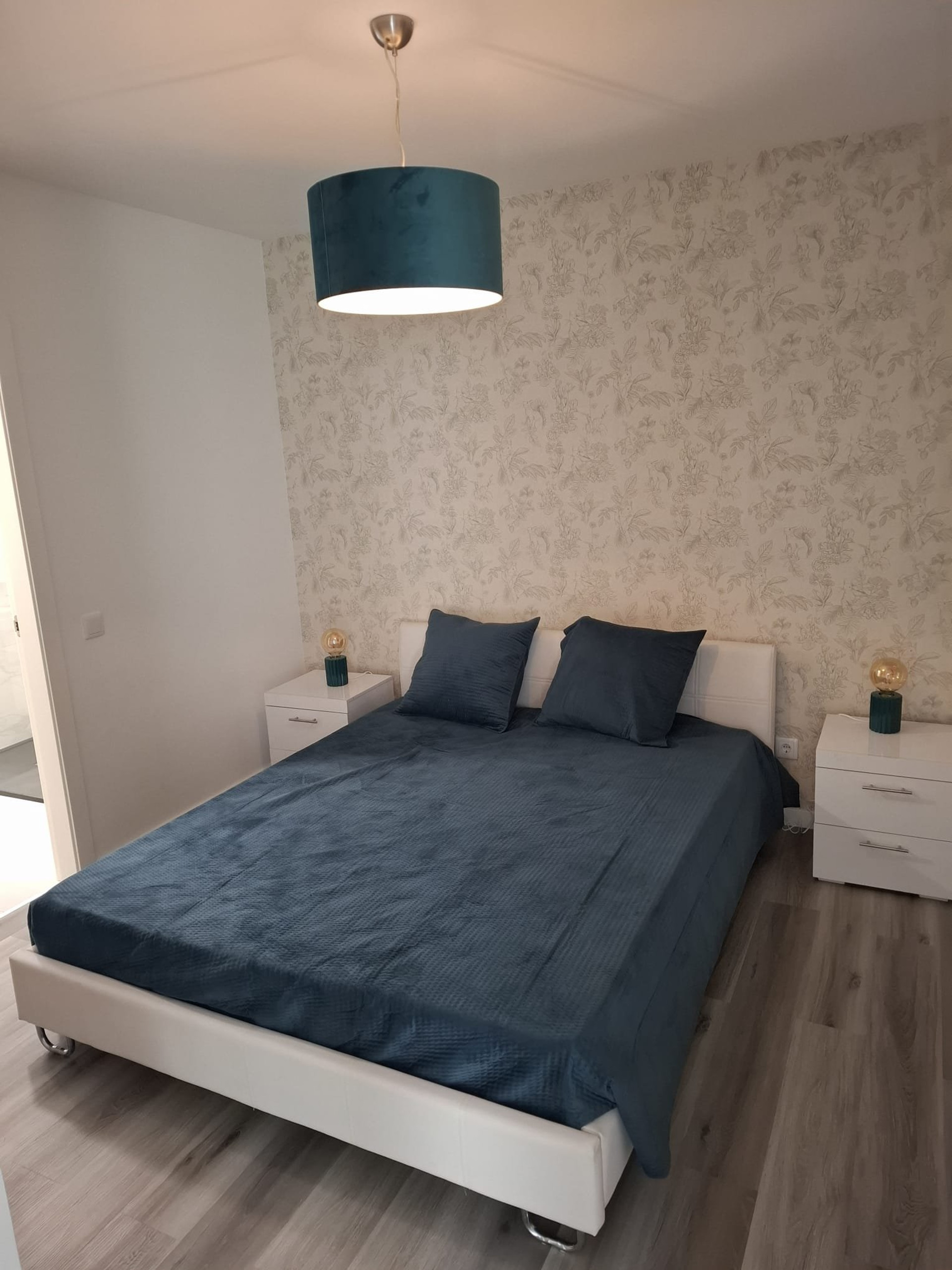 Bedroom with blue bedspread