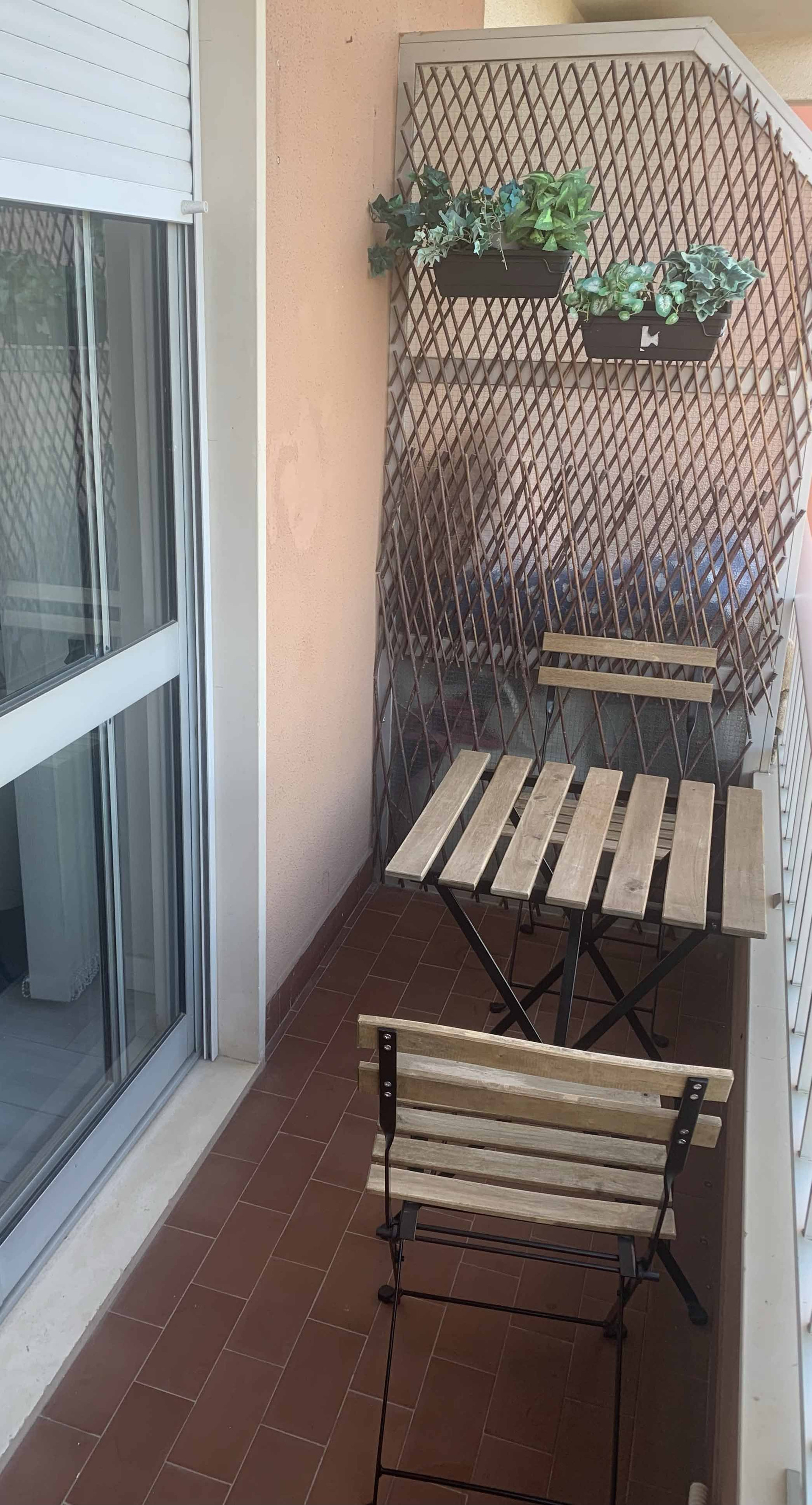 Small balcony with table and chairs