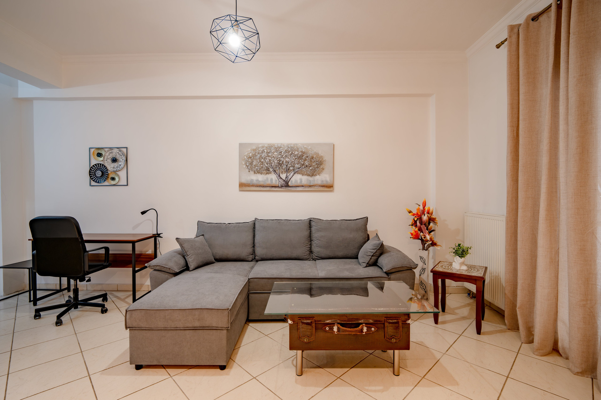 Living room with sofa and workspace