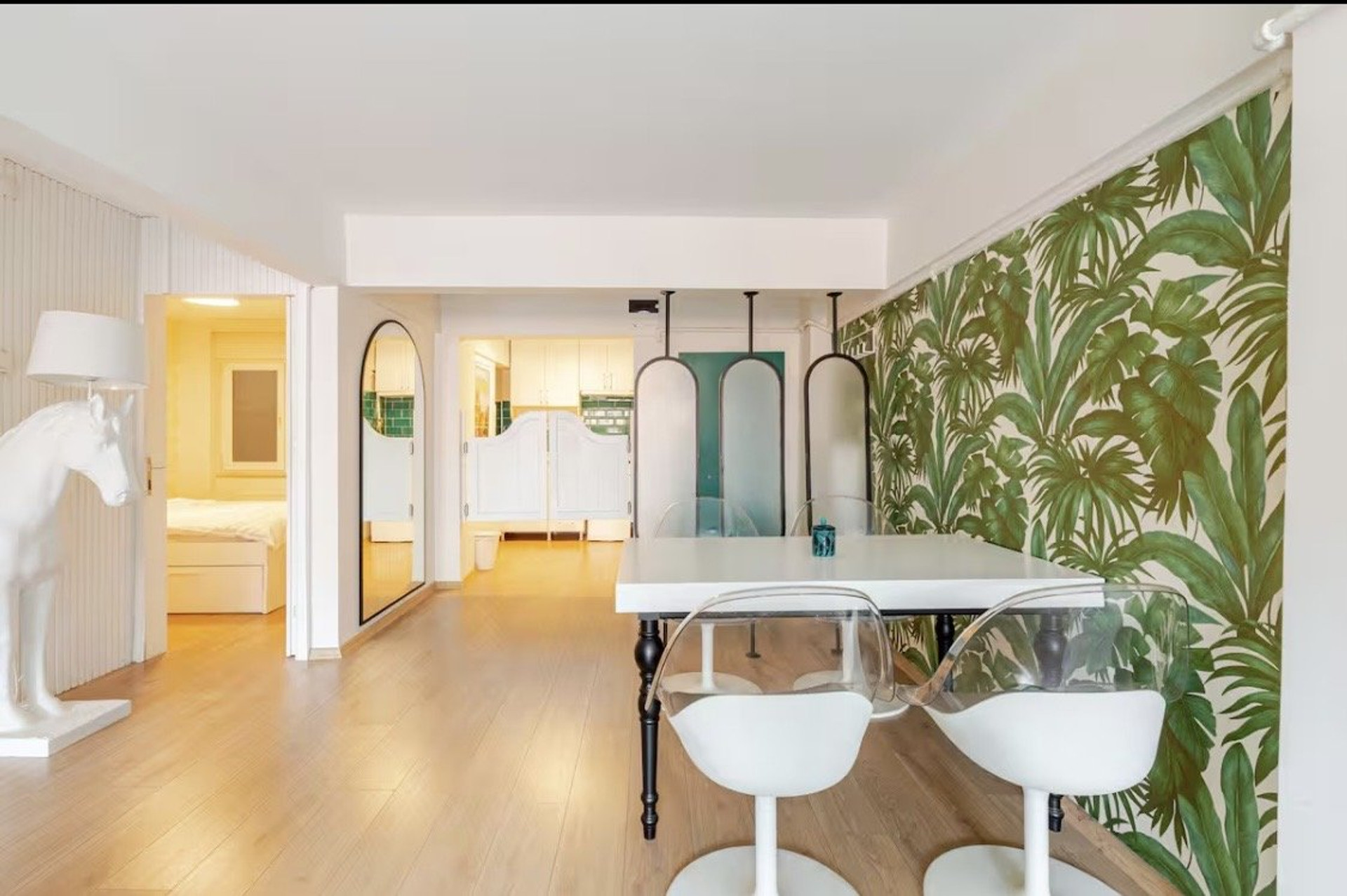 Dining area with tropical wallpaper
