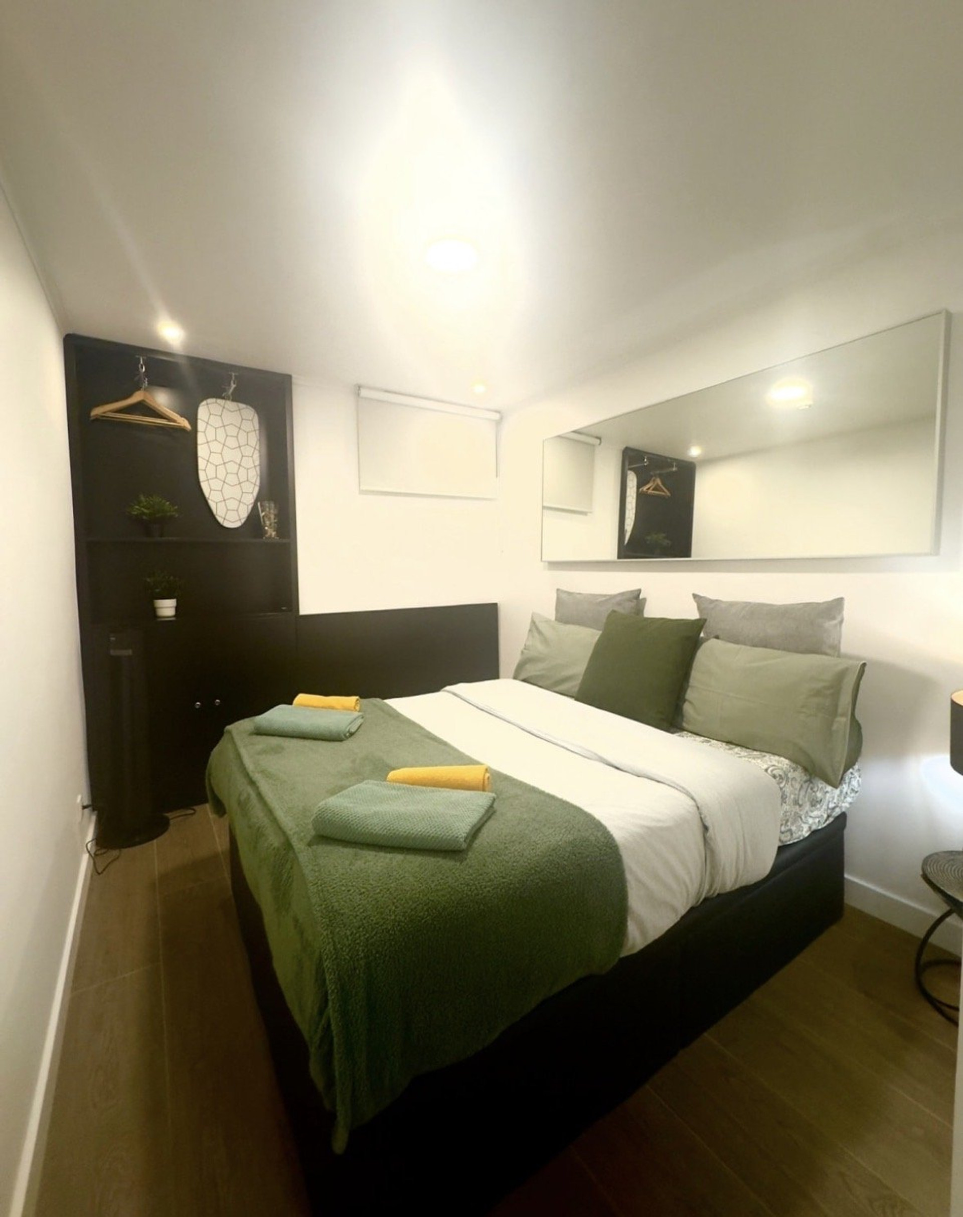 Bedroom with wardrobe and mirror