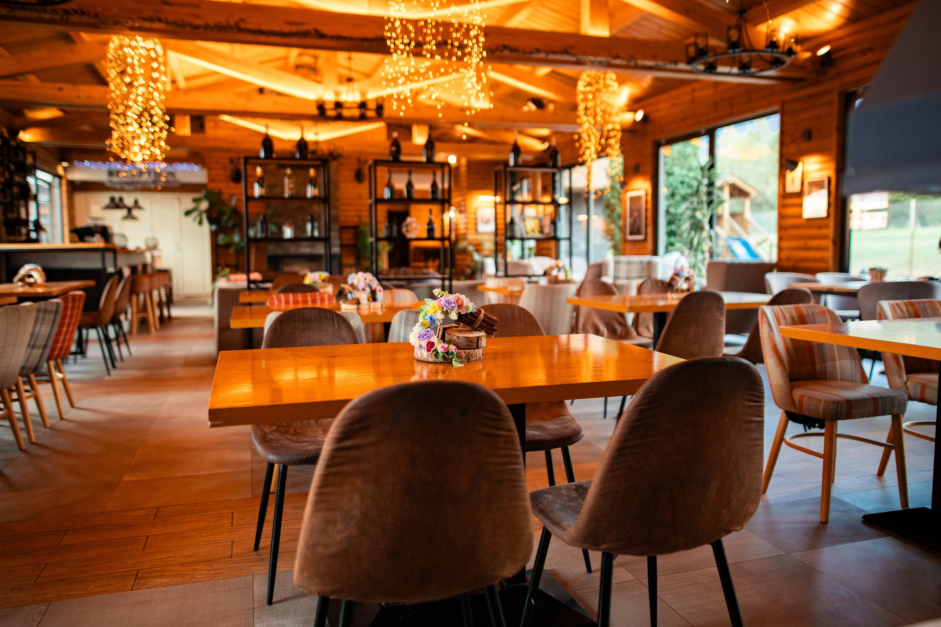 An elegant dining space filled with natural light, offering a pleasant atmosphere for breakfast, work, or evening meals.