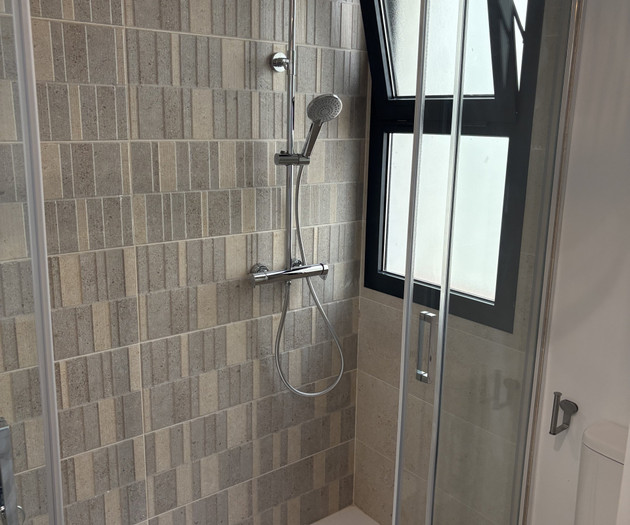 Modern shower with tiled walls