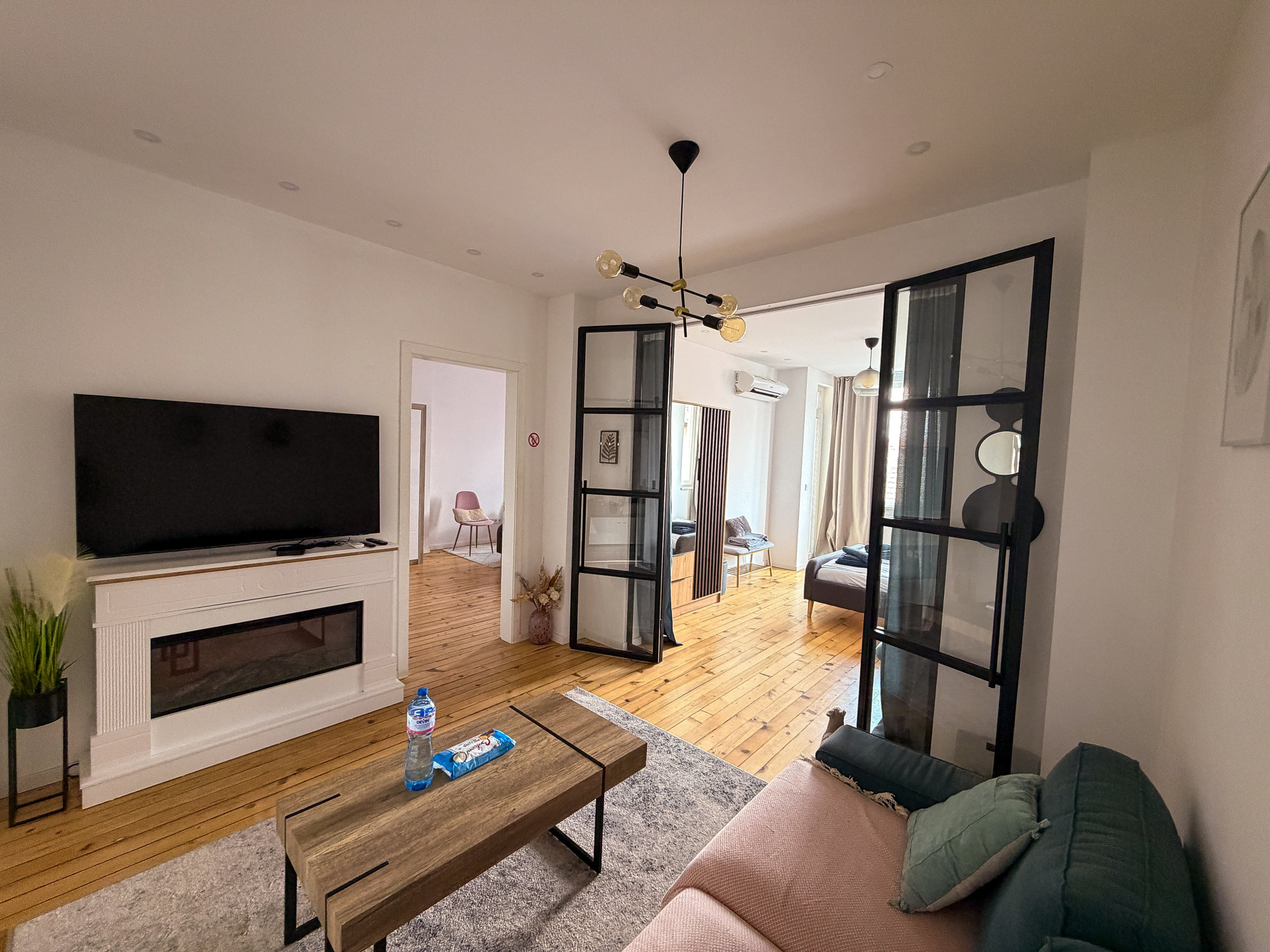 Living room with fireplace and TV