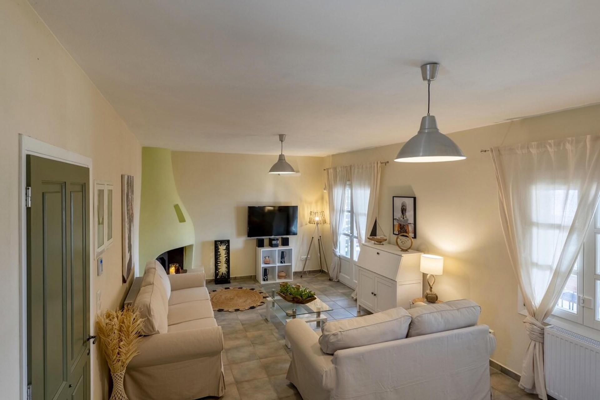 A sun-drenched sanctuary where contemporary elegance meets Mediterranean charm. Bask in the luminous living space adorned with tasteful neutrals, plush seating, and artful accents.