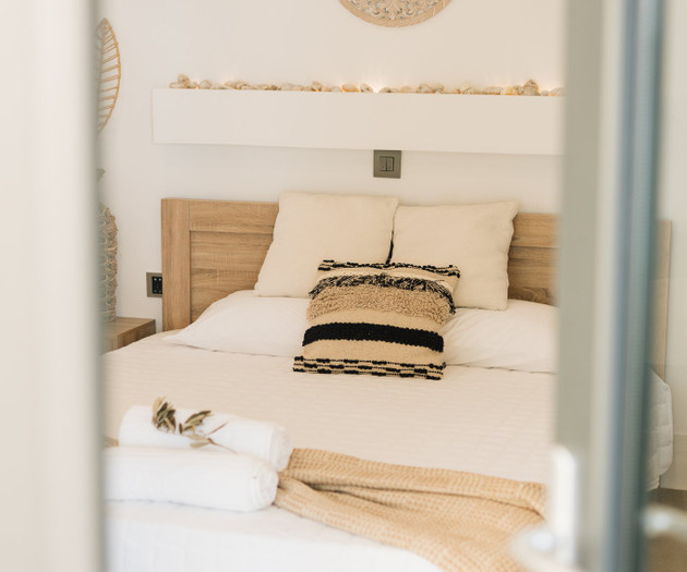 Bed seen through glass door