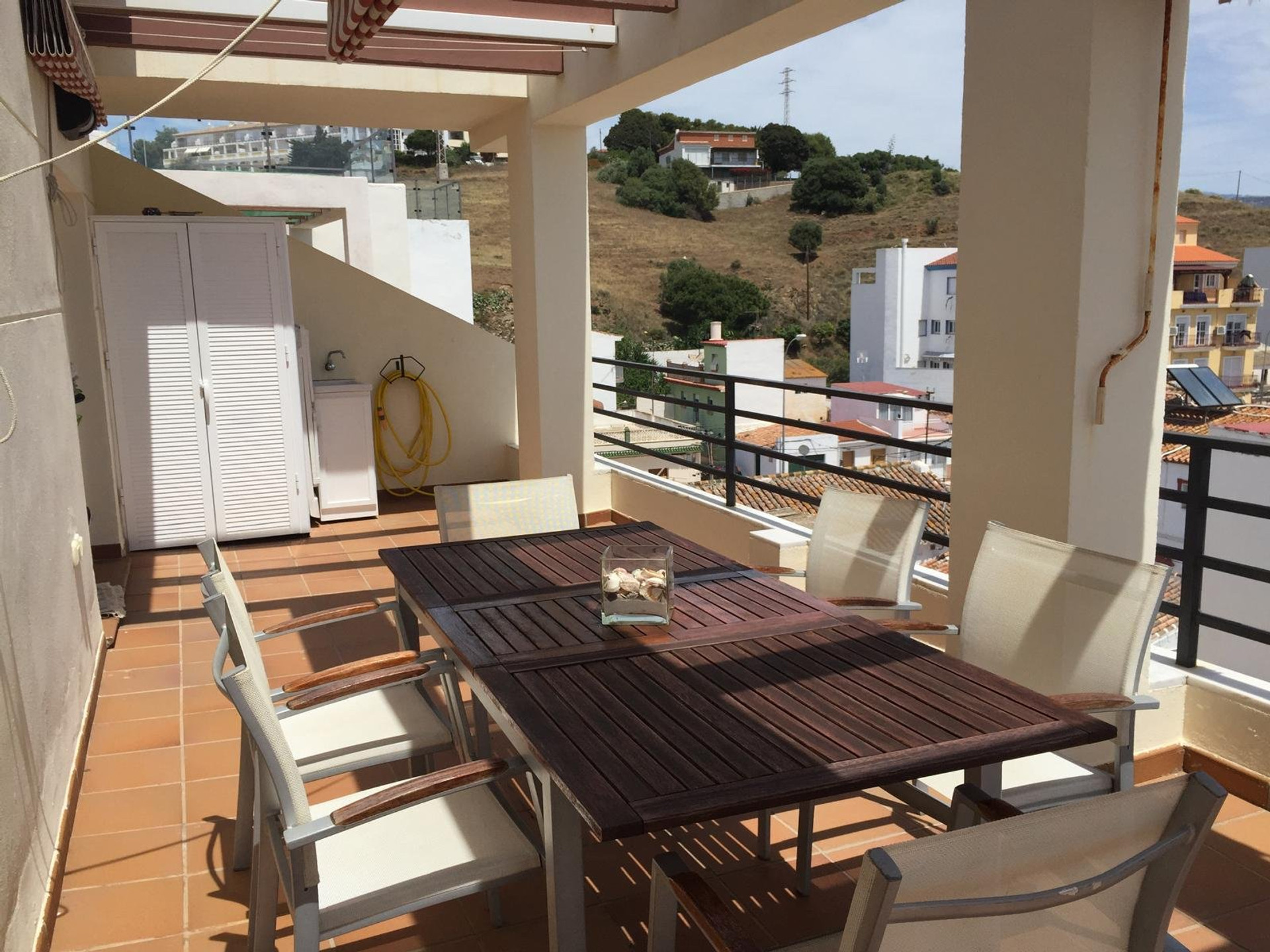 Terrace dining table, hillside view