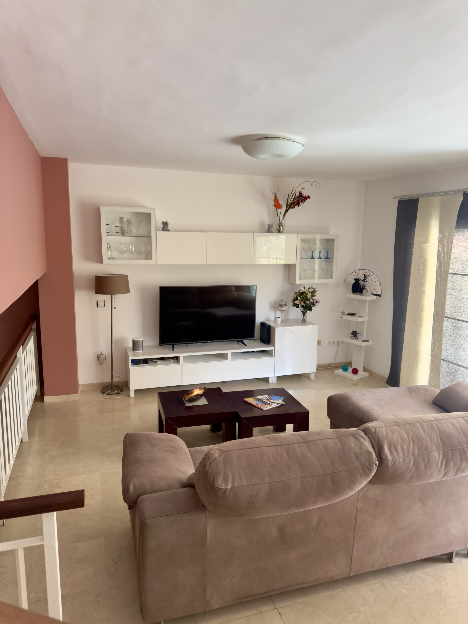 Bright living room with TV