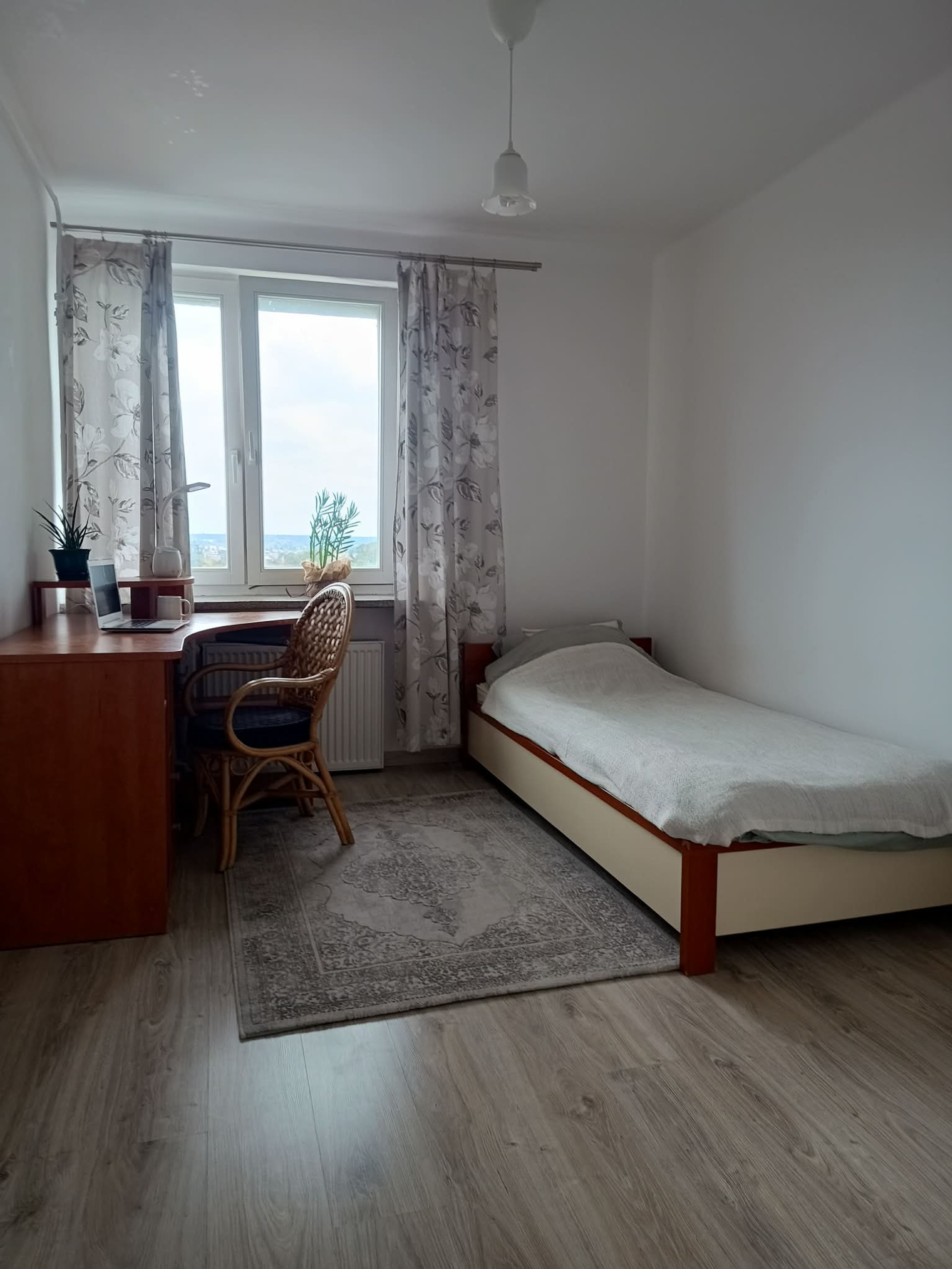 Bedroom with desk and bed