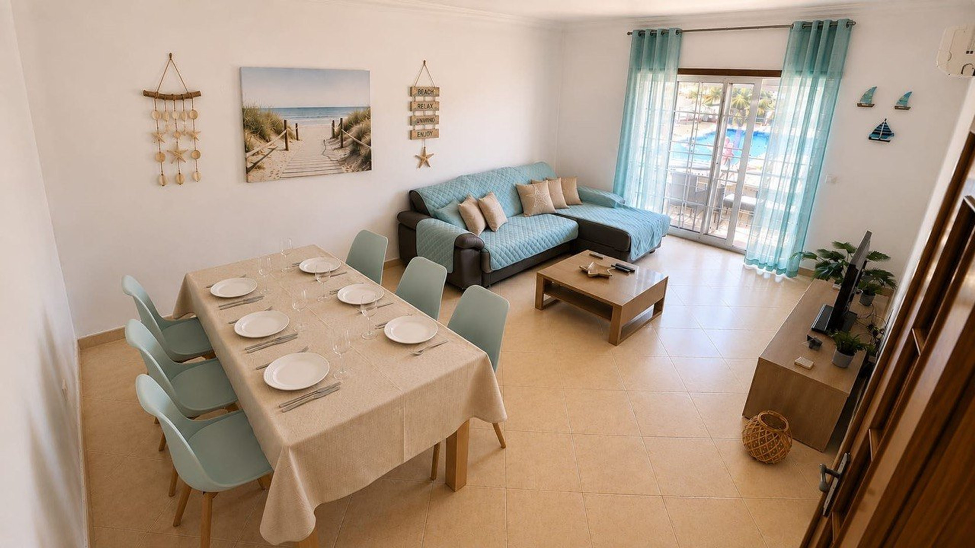 Living room with dining table pool view