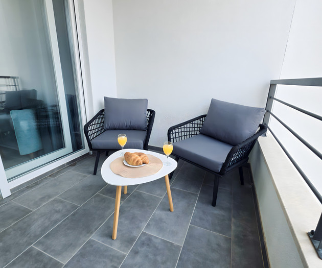 Balcony seating area with drinks