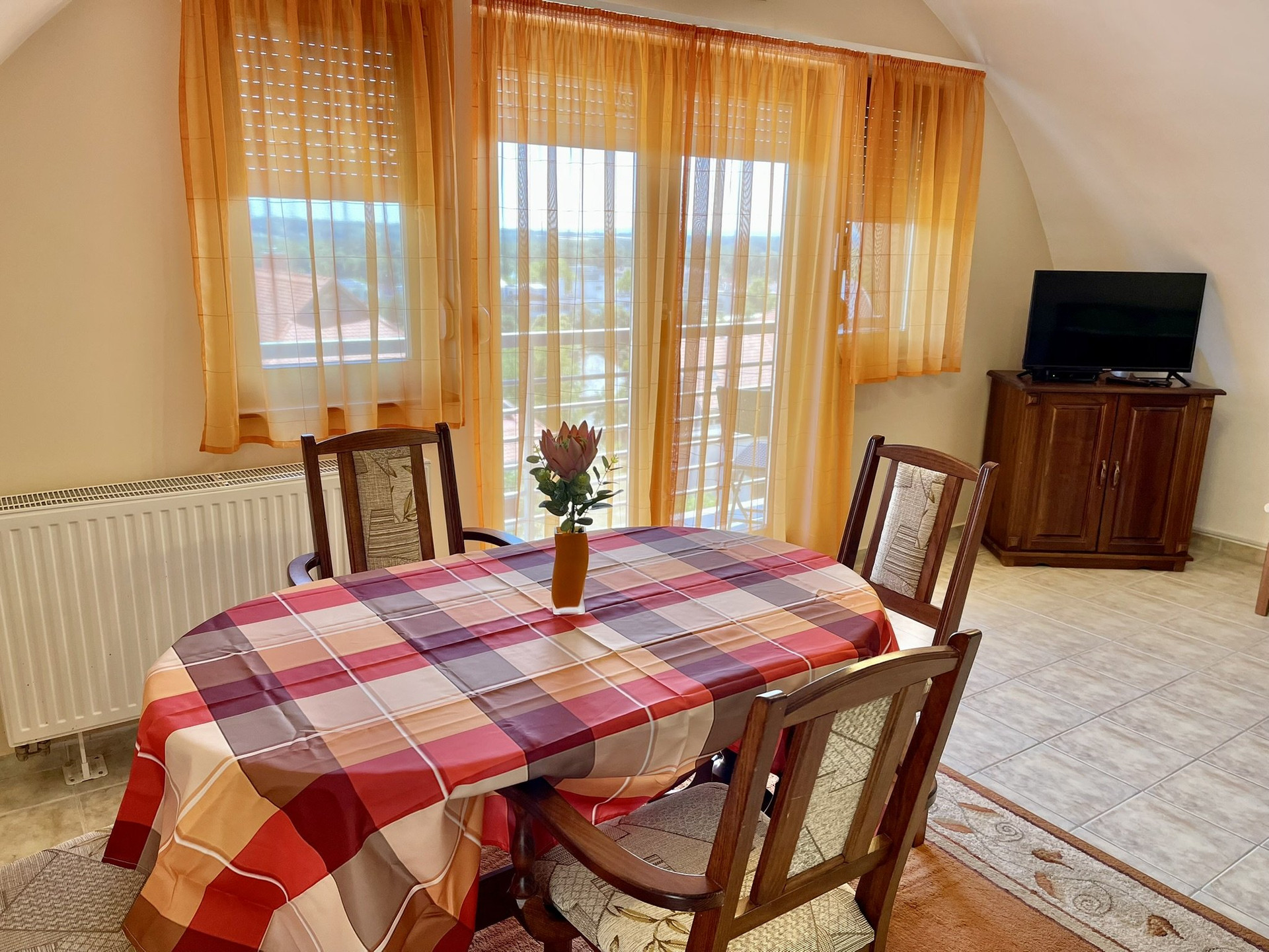 Dining table by balcony doors