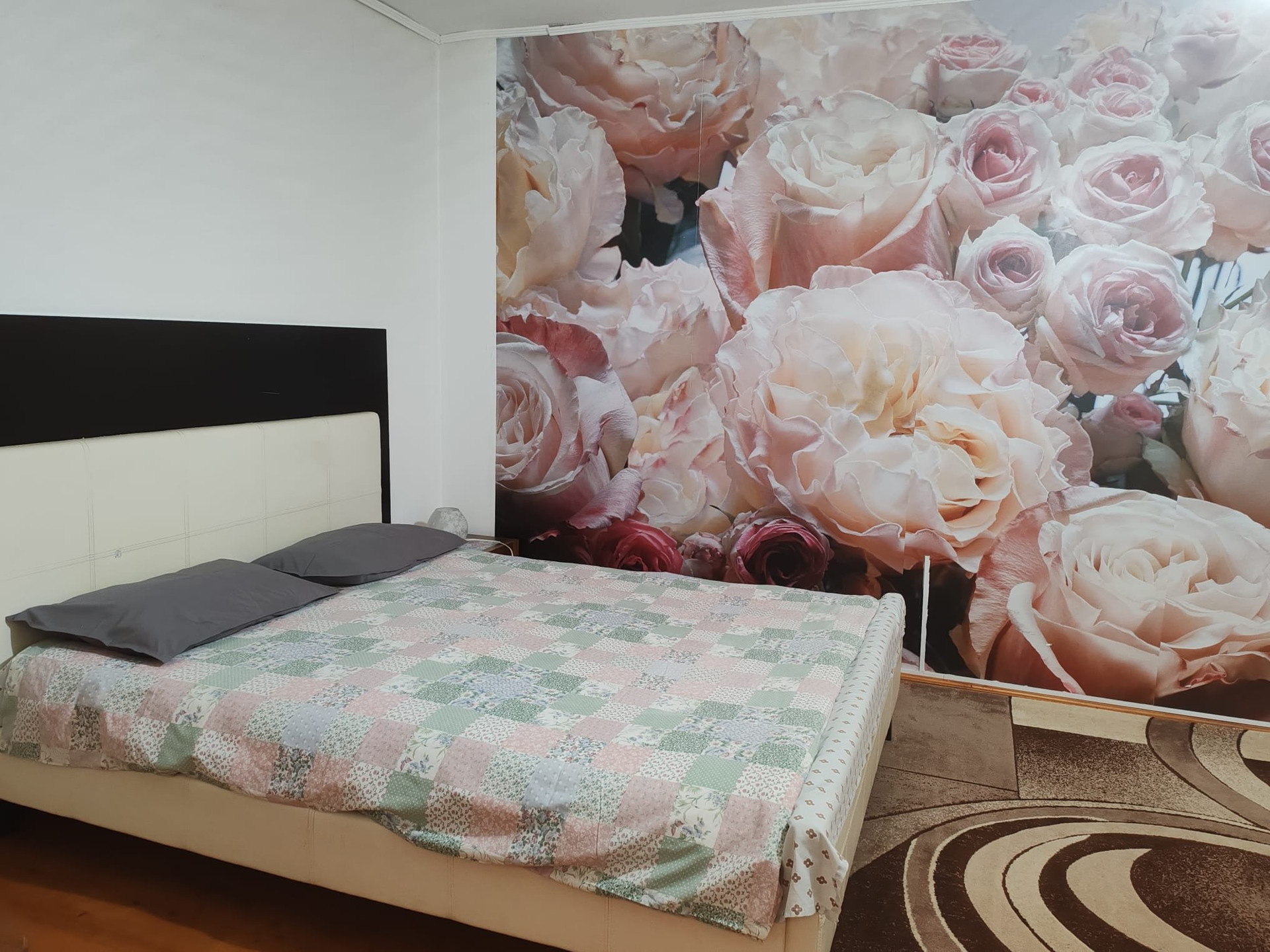 Bedroom 2: Double bed with roses wallpaper