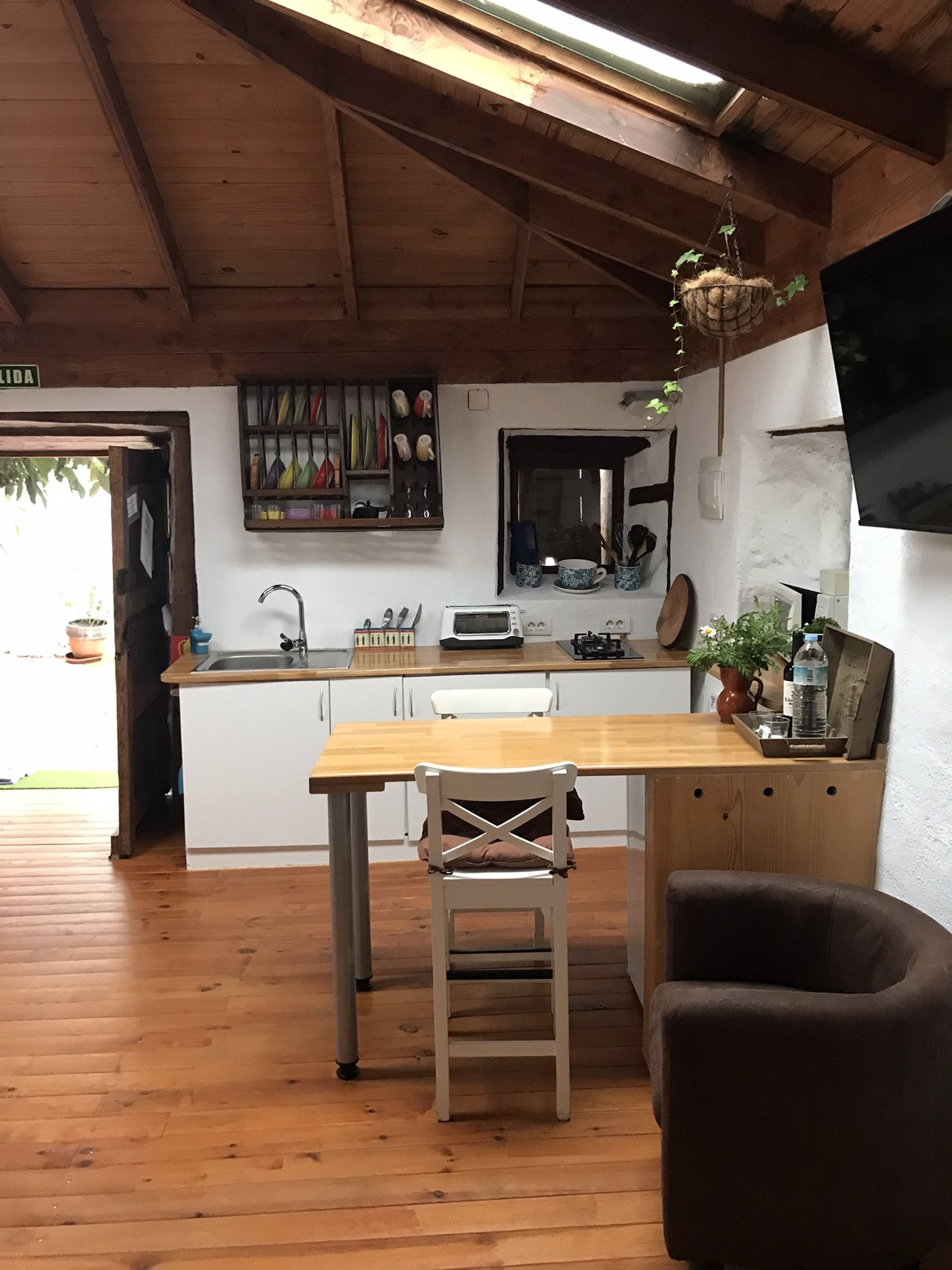 Rustic kitchen with wooden ceiling
