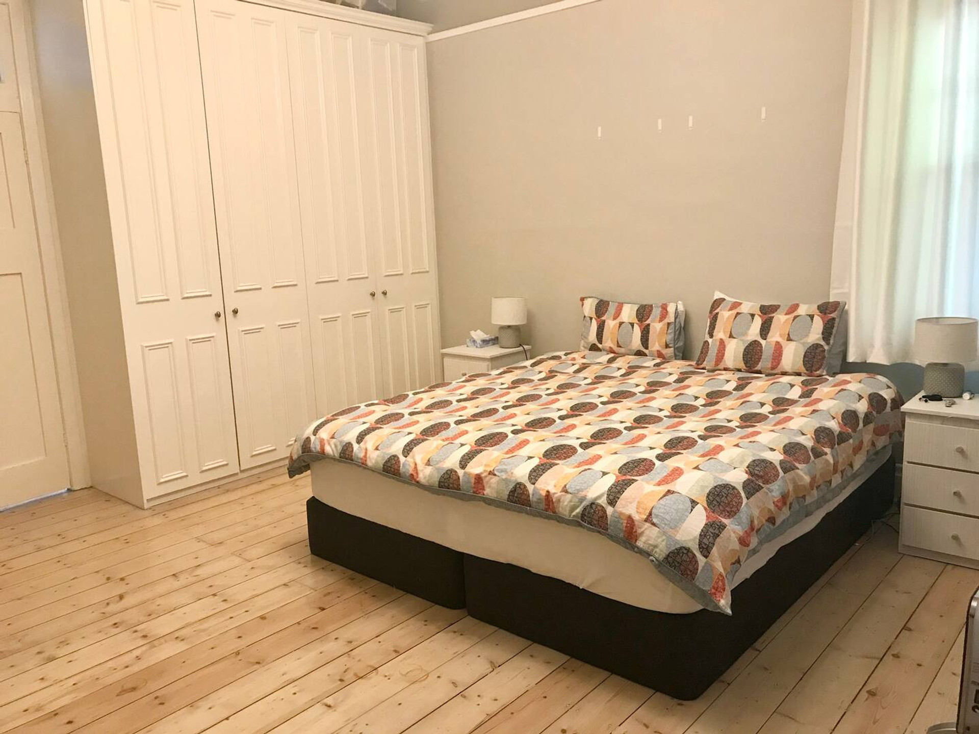 First bedroom with king bed + wardrobes + drawers