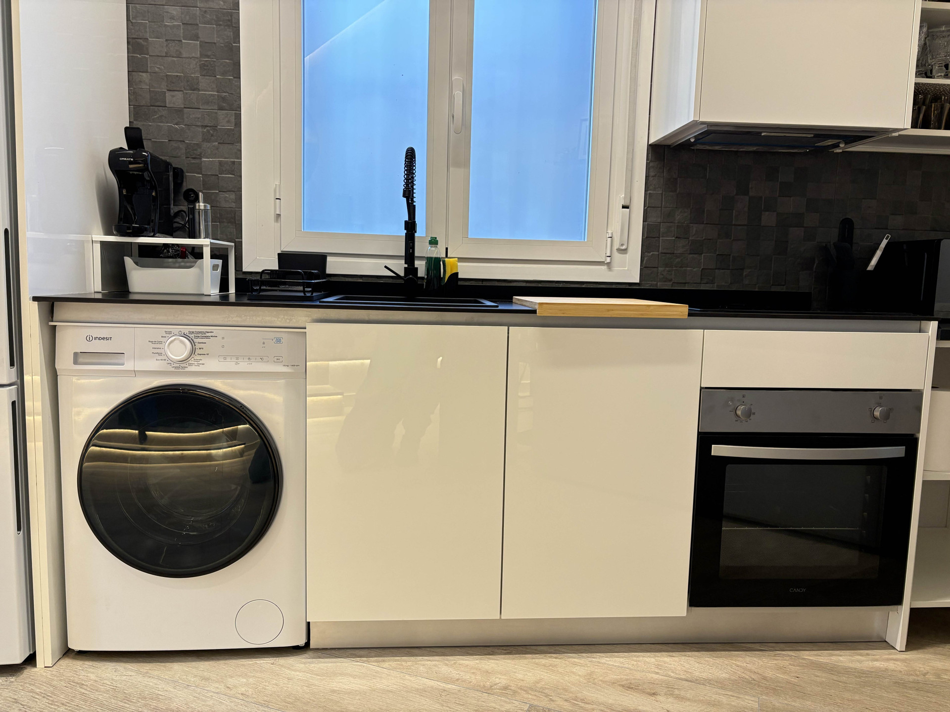 Kitchen with washer and oven