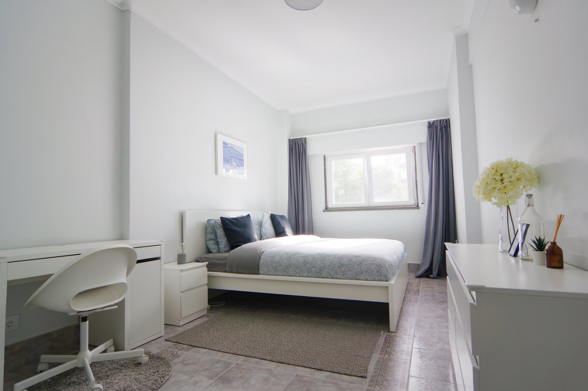 Bright master bedroom with double bed