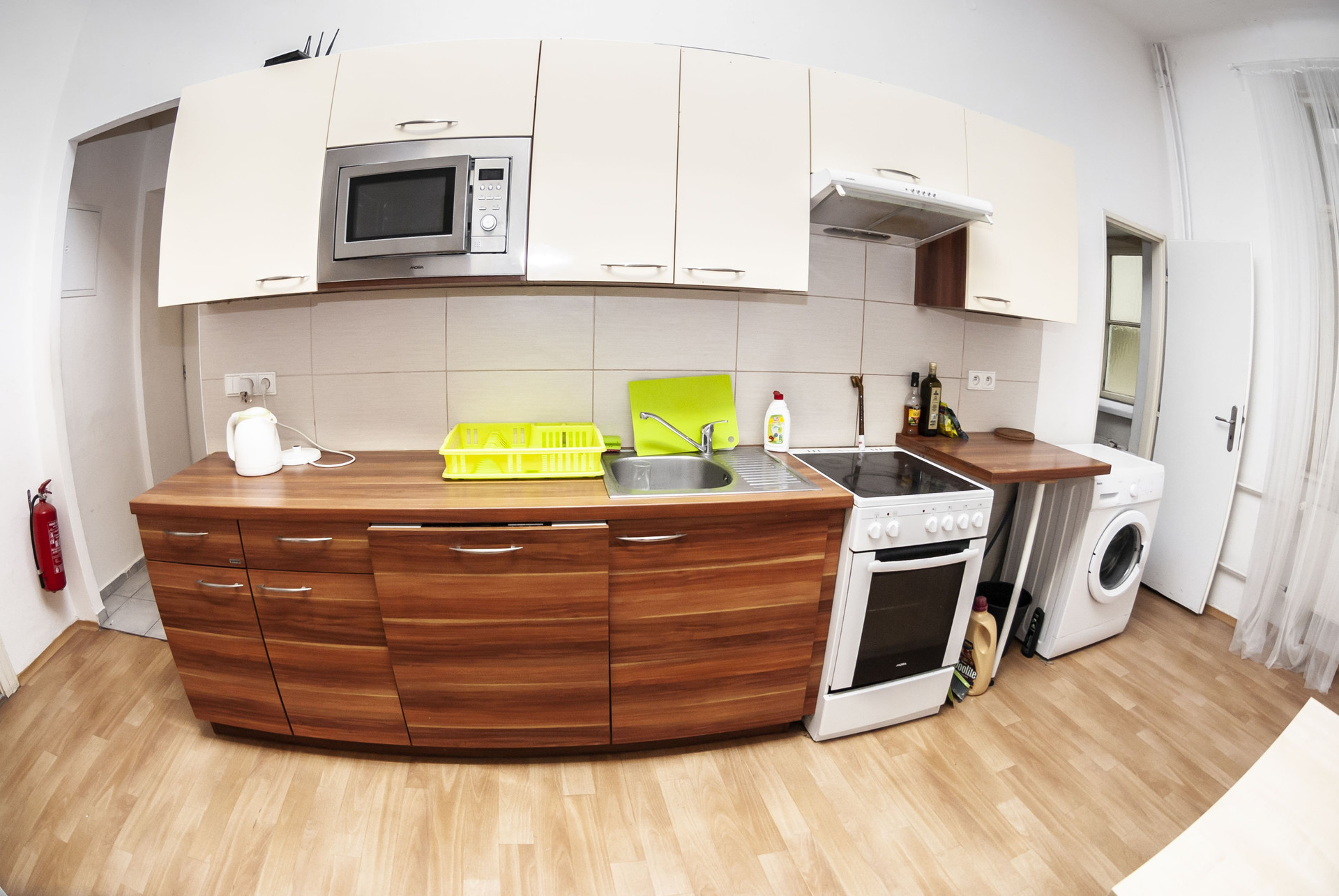 Kitchen with wooden cabinets and appliances