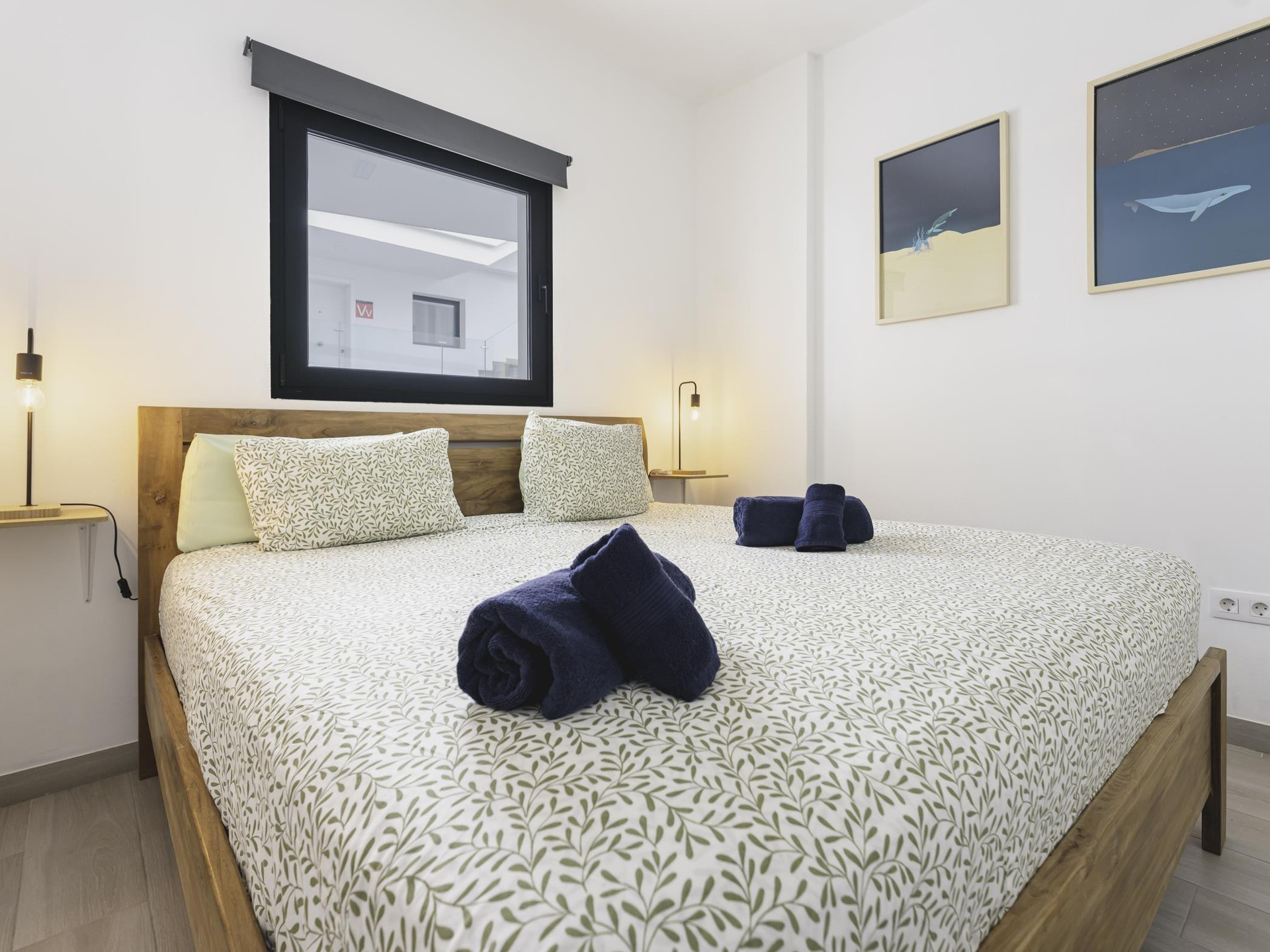 Double bedroom with wood headboard