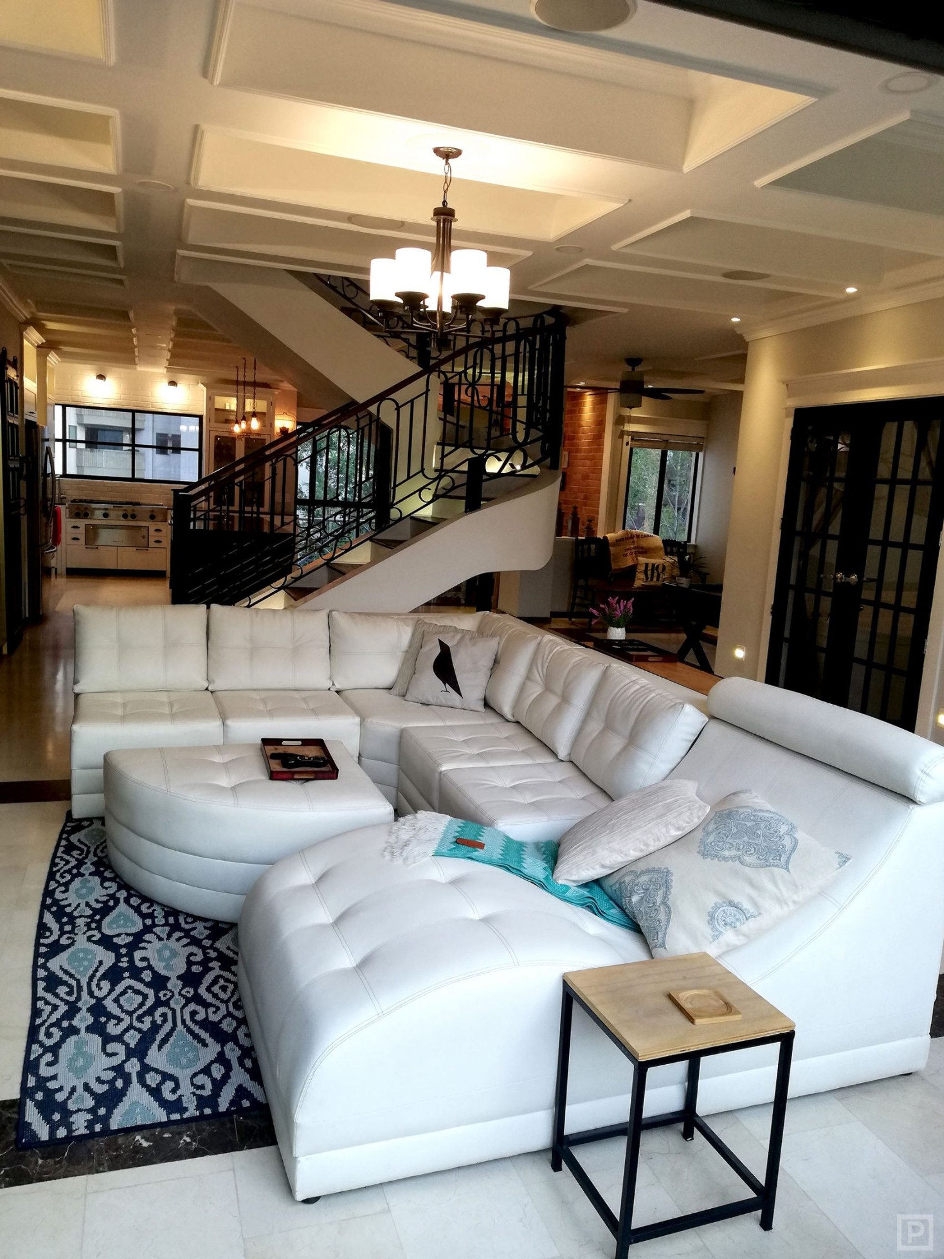 Main living room has wall-to-wall view windows, 65" 4k smart TV, surround sound home theater & more!