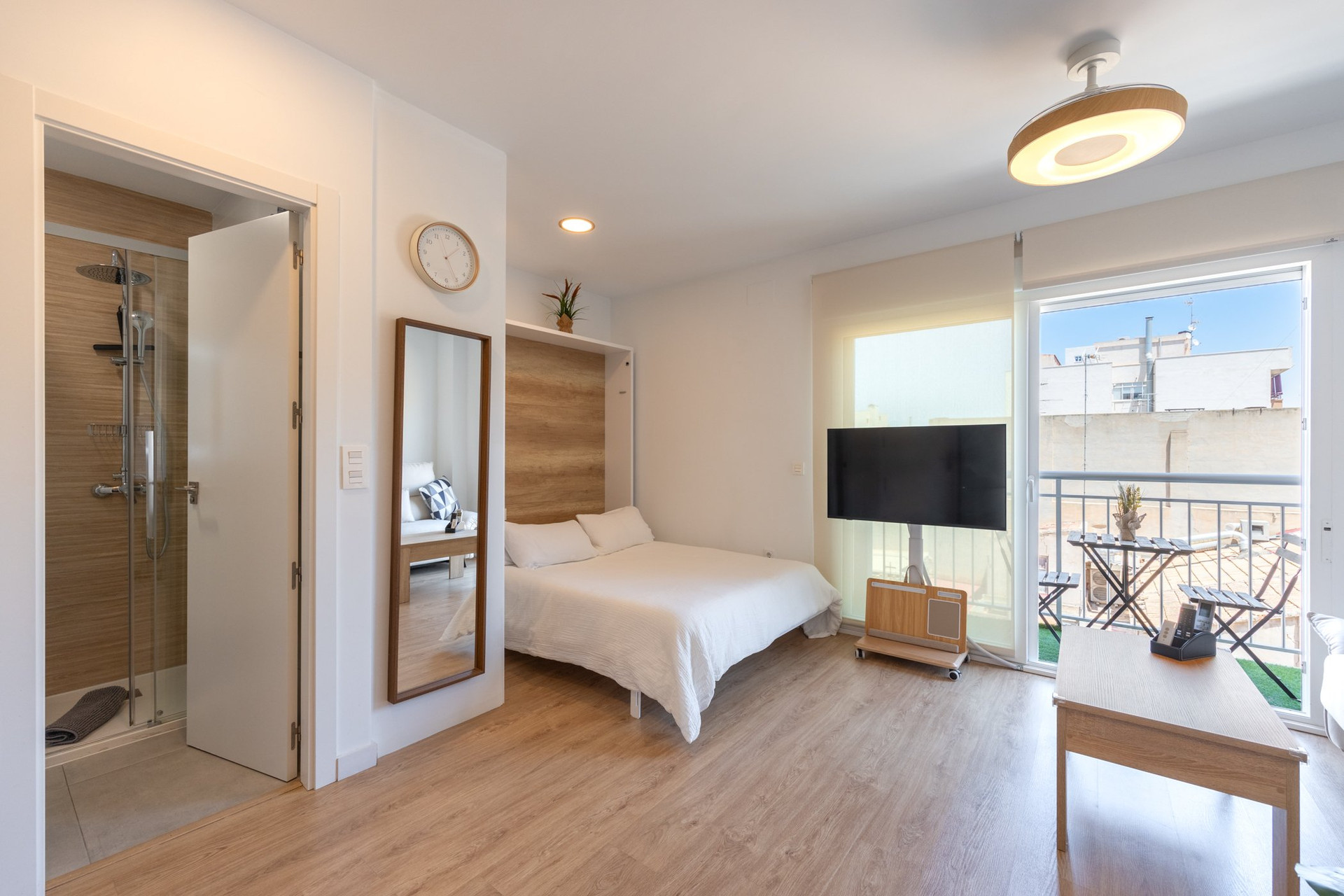 Studio overview with bathroom and balcony