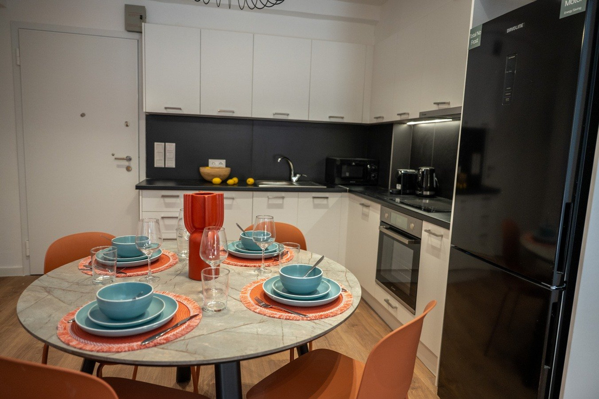 Kitchen dining setup with fridge