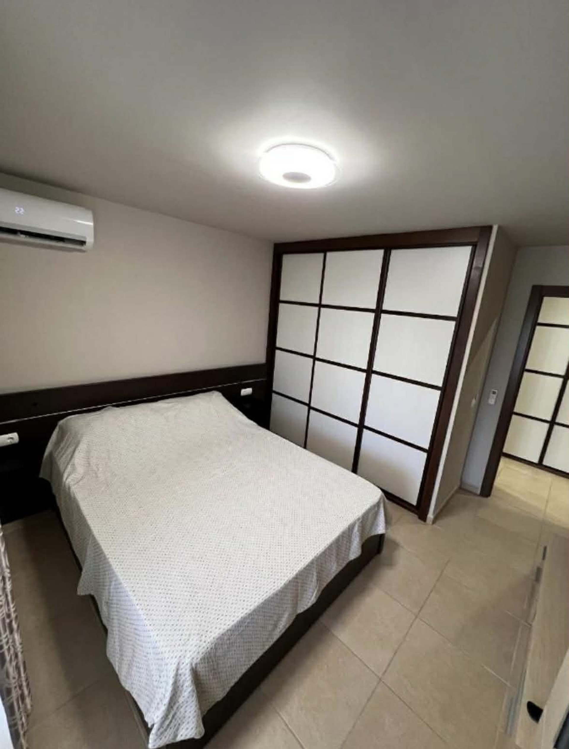 Bedroom with sliding wardrobe