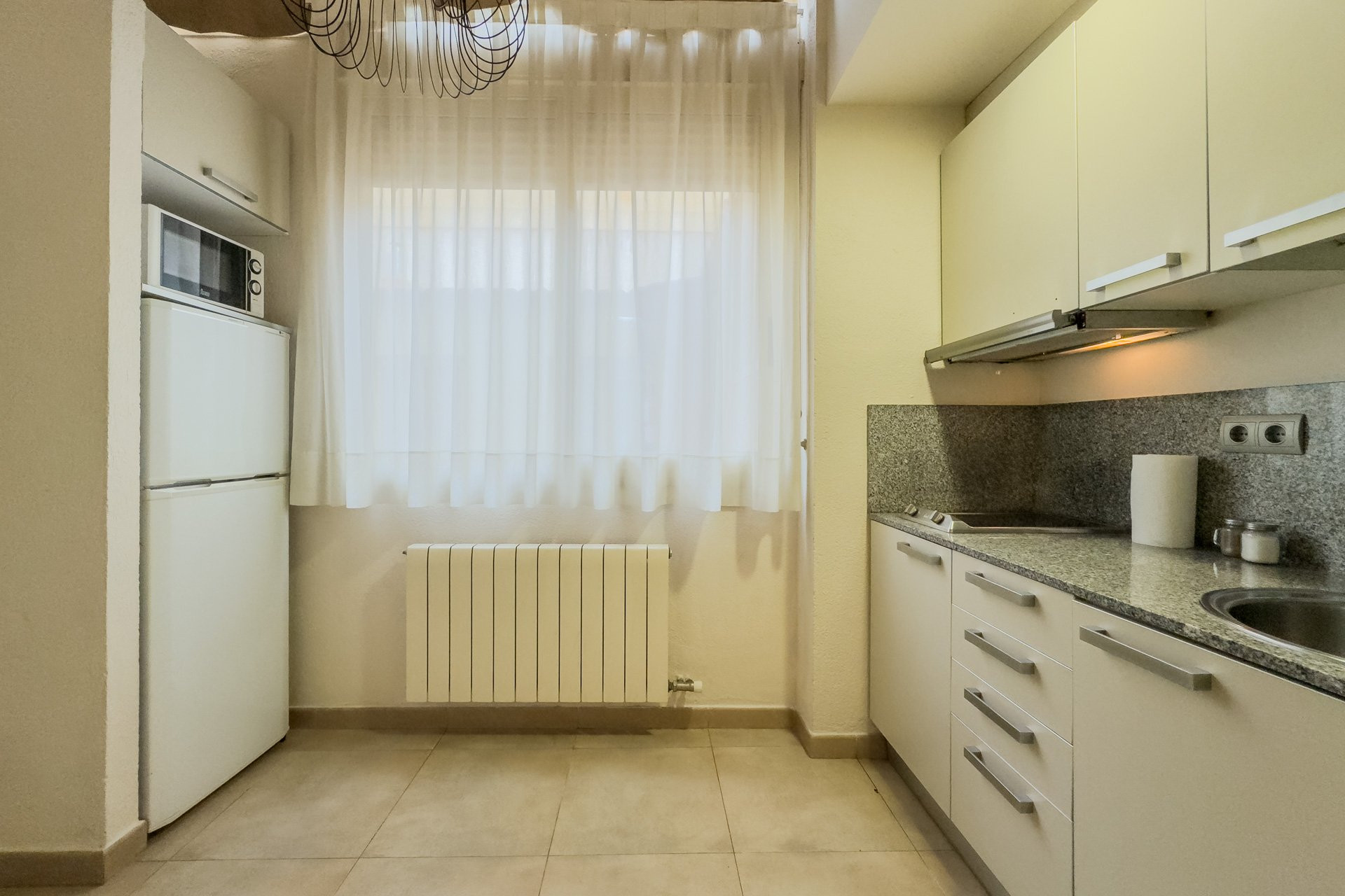 Kitchen with fridge and stove