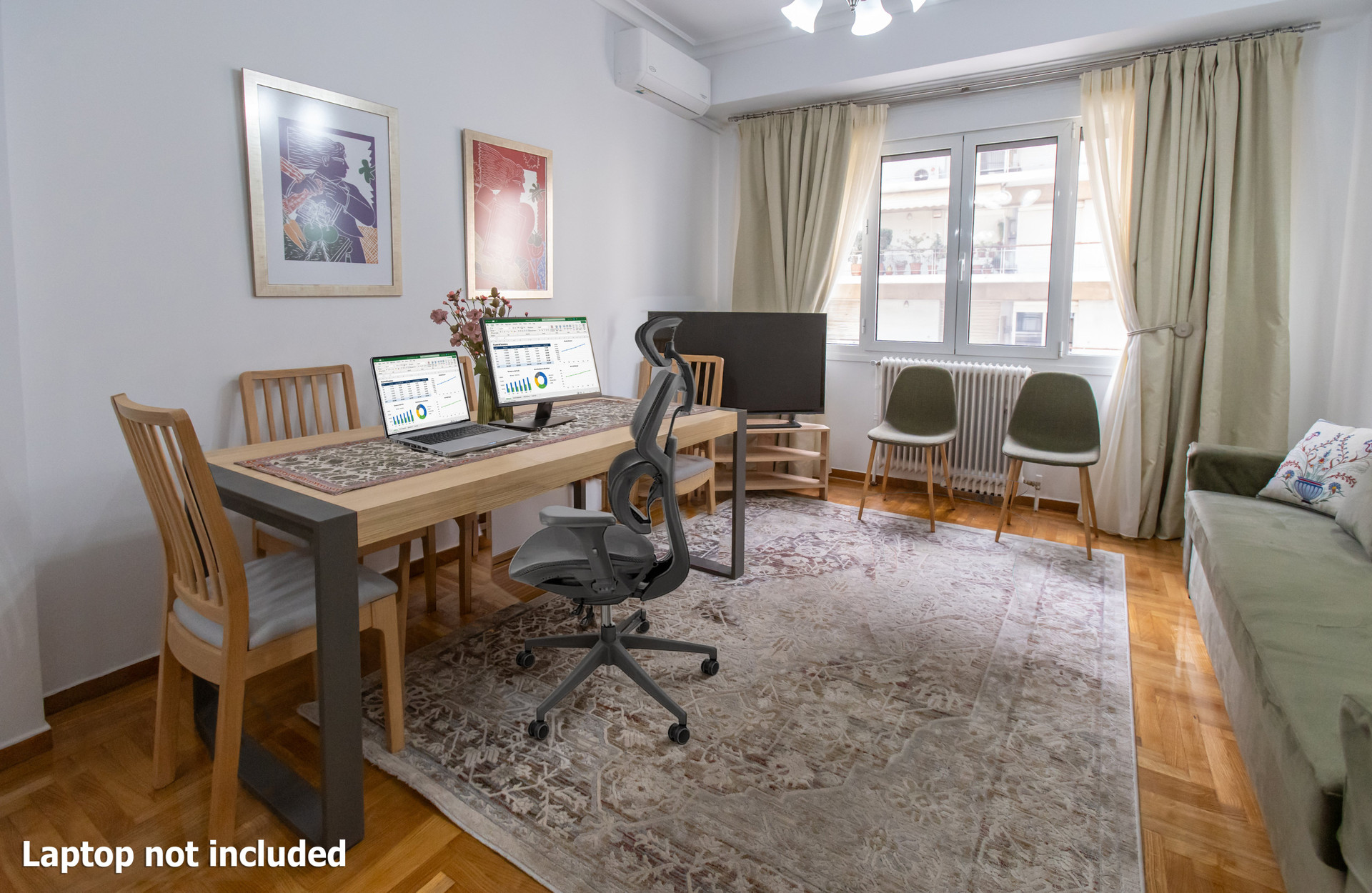 Dedicated workspace with ergonomic office chair and 17" monitor. A second workstation can be set up upon request for guests working remotely.