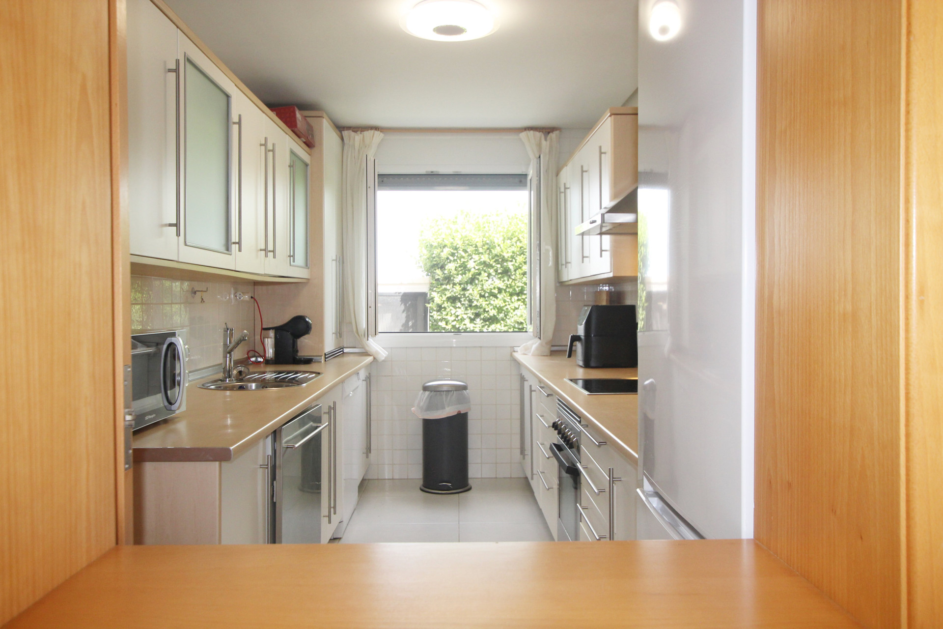 Galley kitchen with appliances