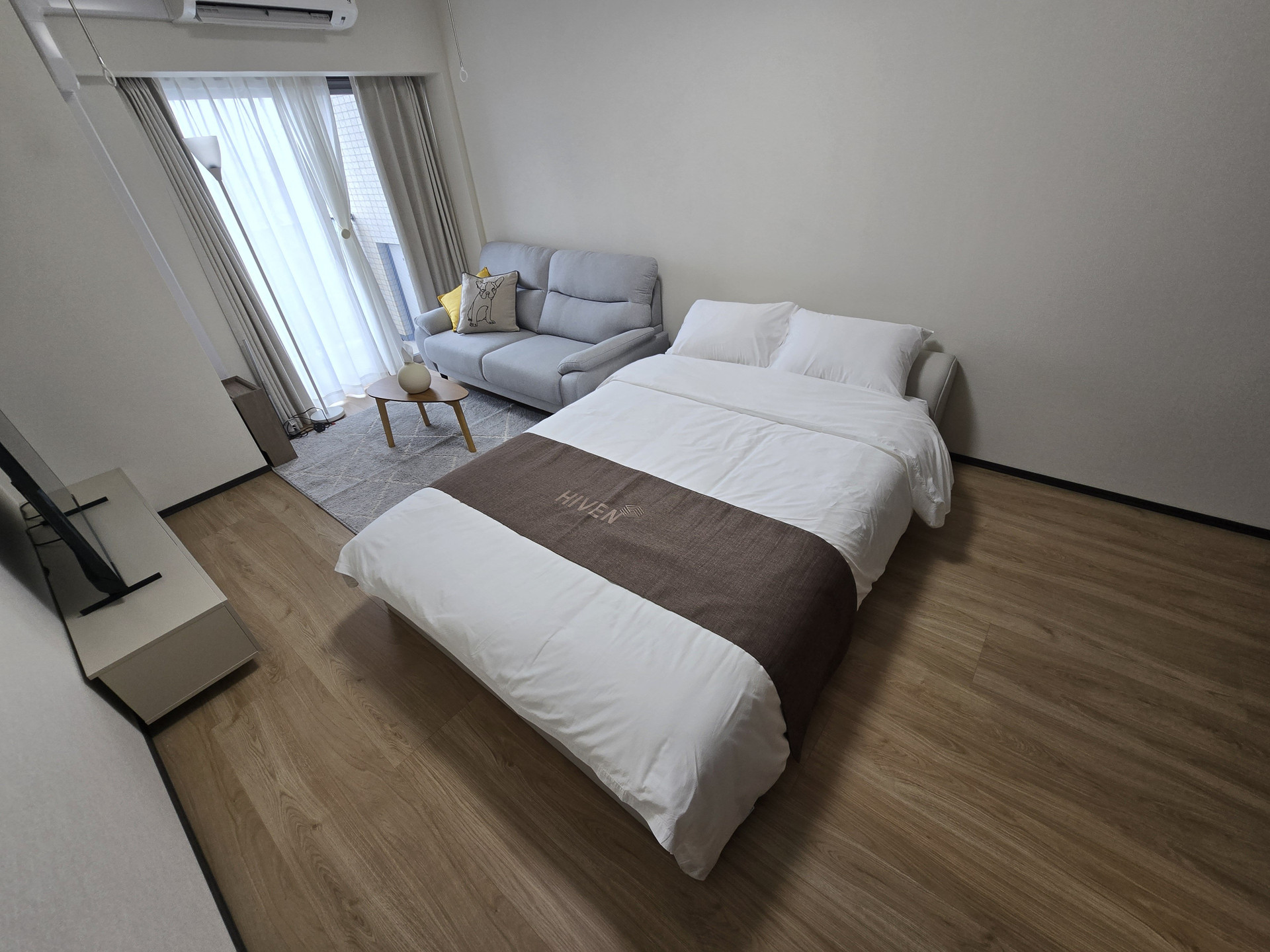 Bright studio with bed and sofa