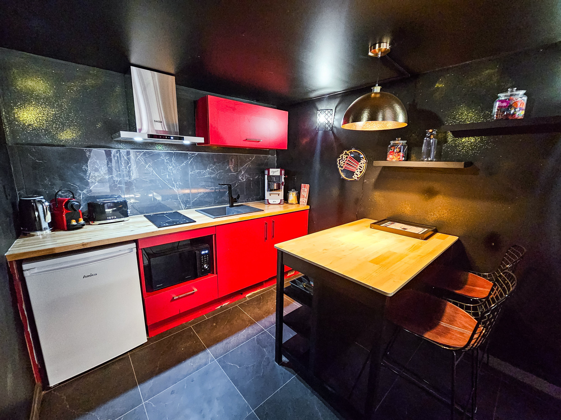 Red kitchenette with dining table