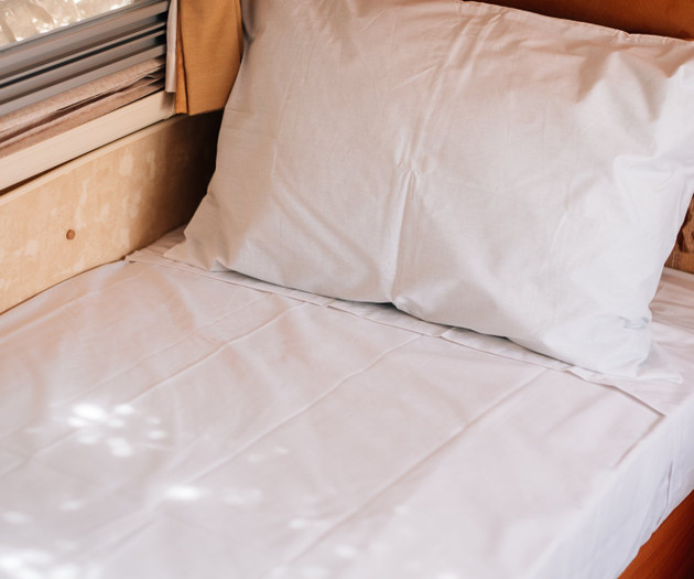 Bed with pillow and window