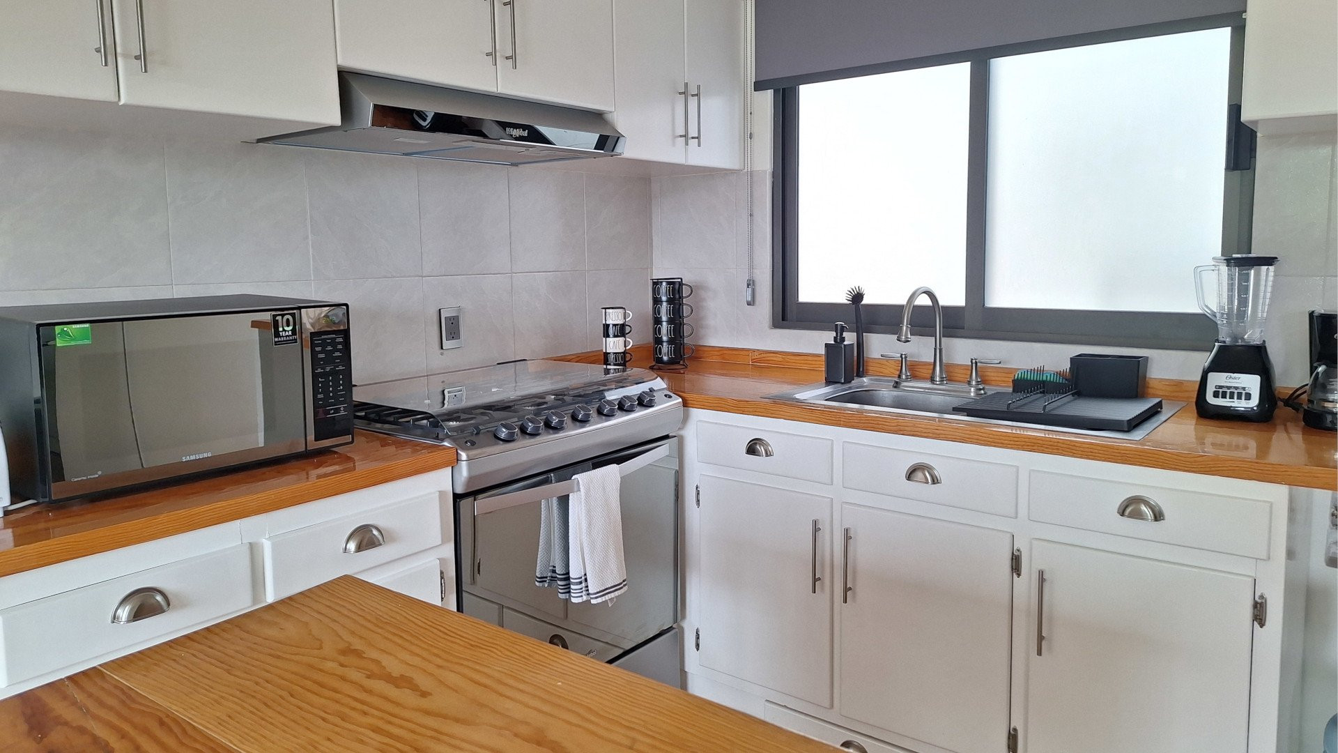 Full kitchen with stove appliances