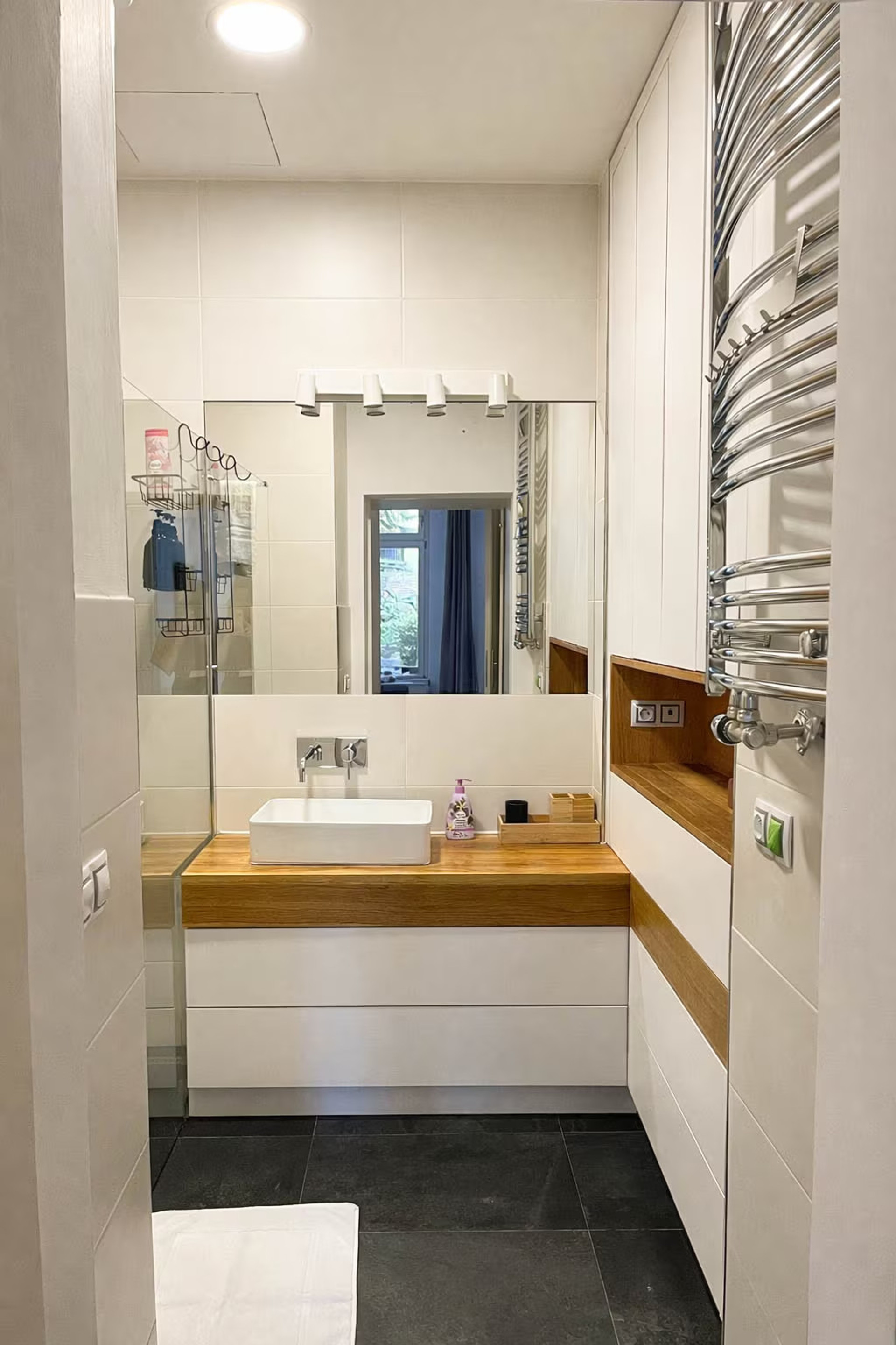 Bathroom vanity with heated towel rail