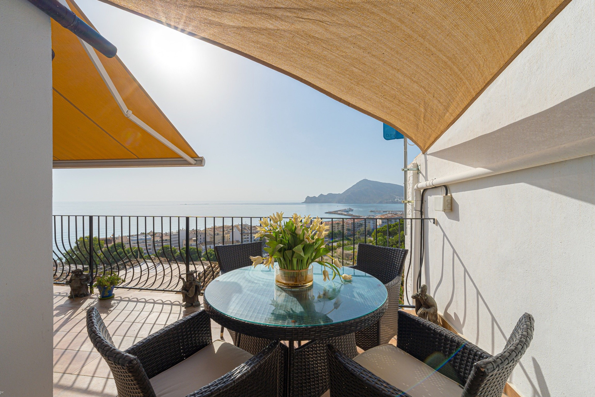 Dining table on balcony with awning