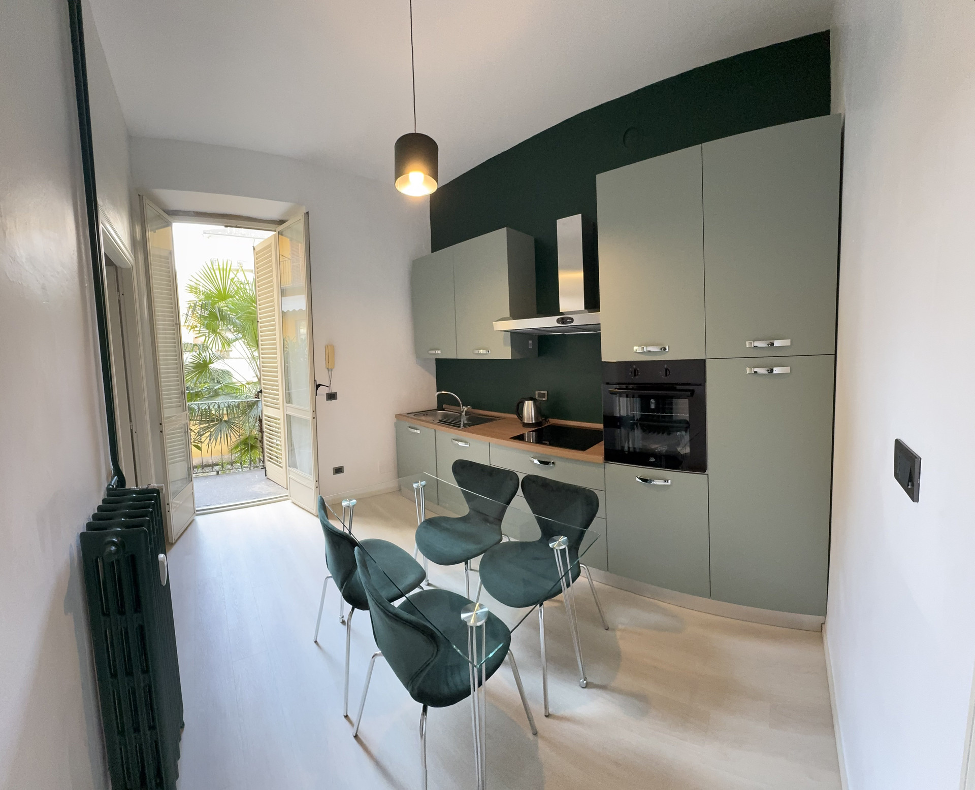 Kitchen with dining area and balcony