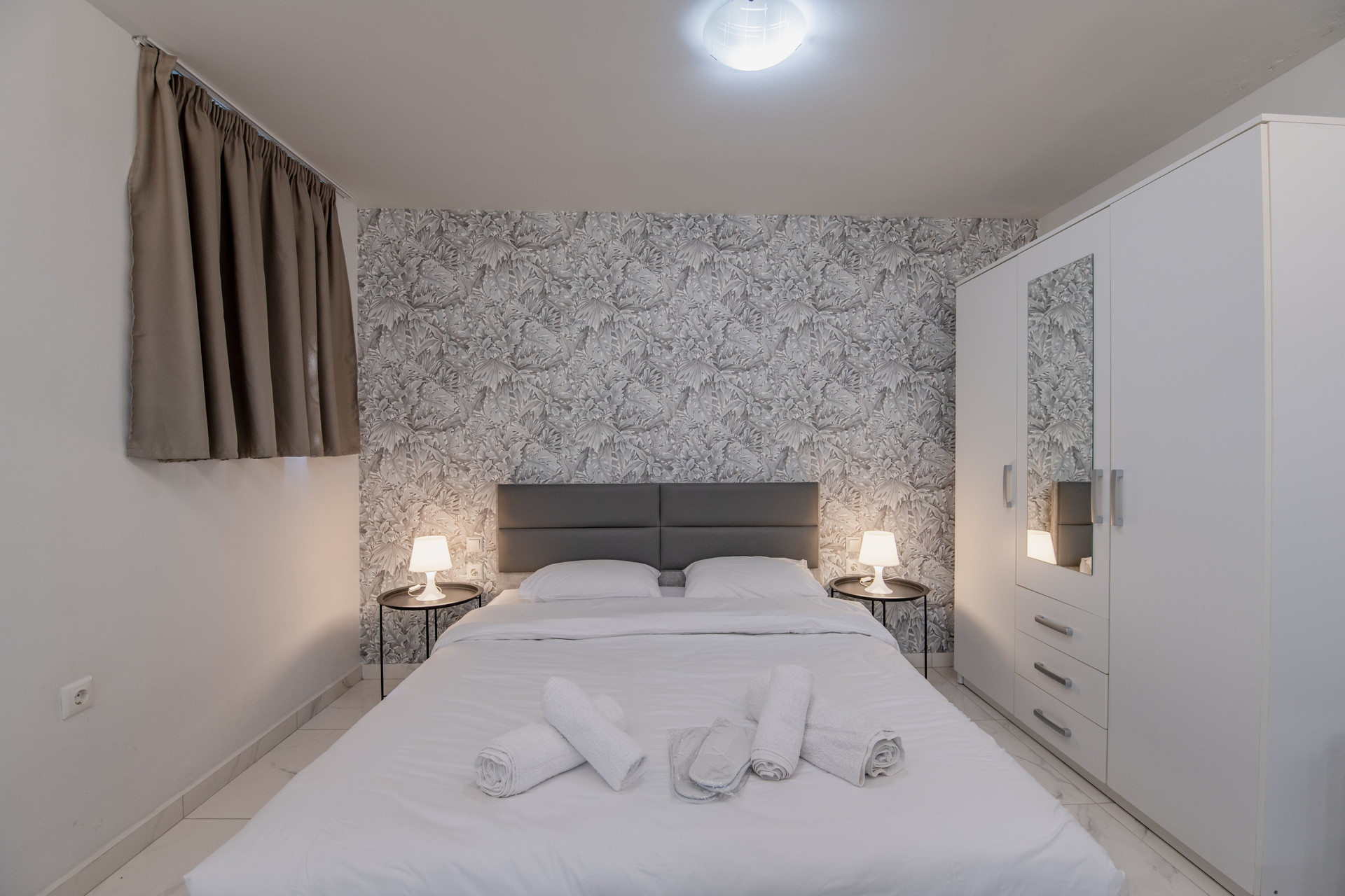 Double bed with patterned accent wall