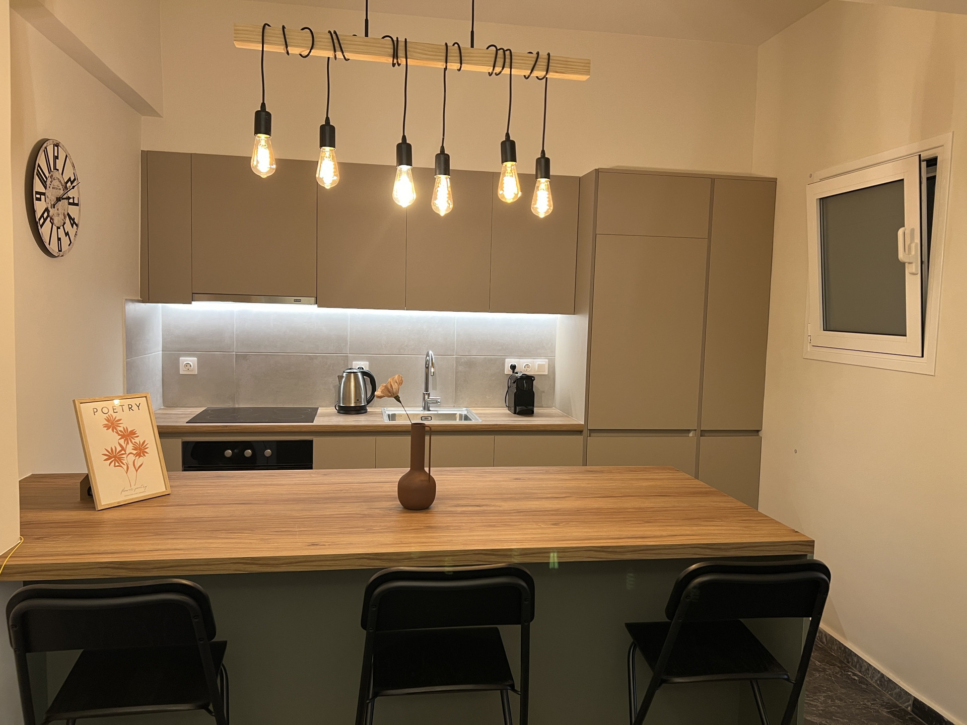 Kitchen with island and bar stools