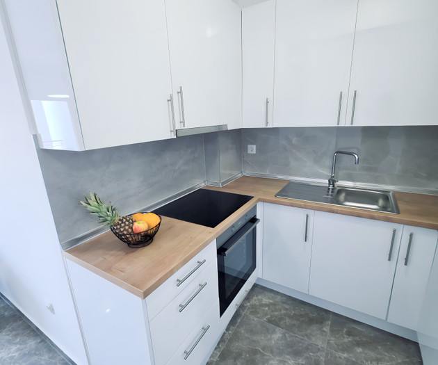 Kitchen with stove and sink