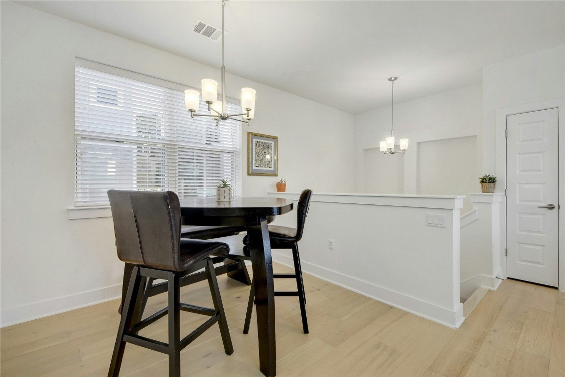 Dining area with chandelier lighting