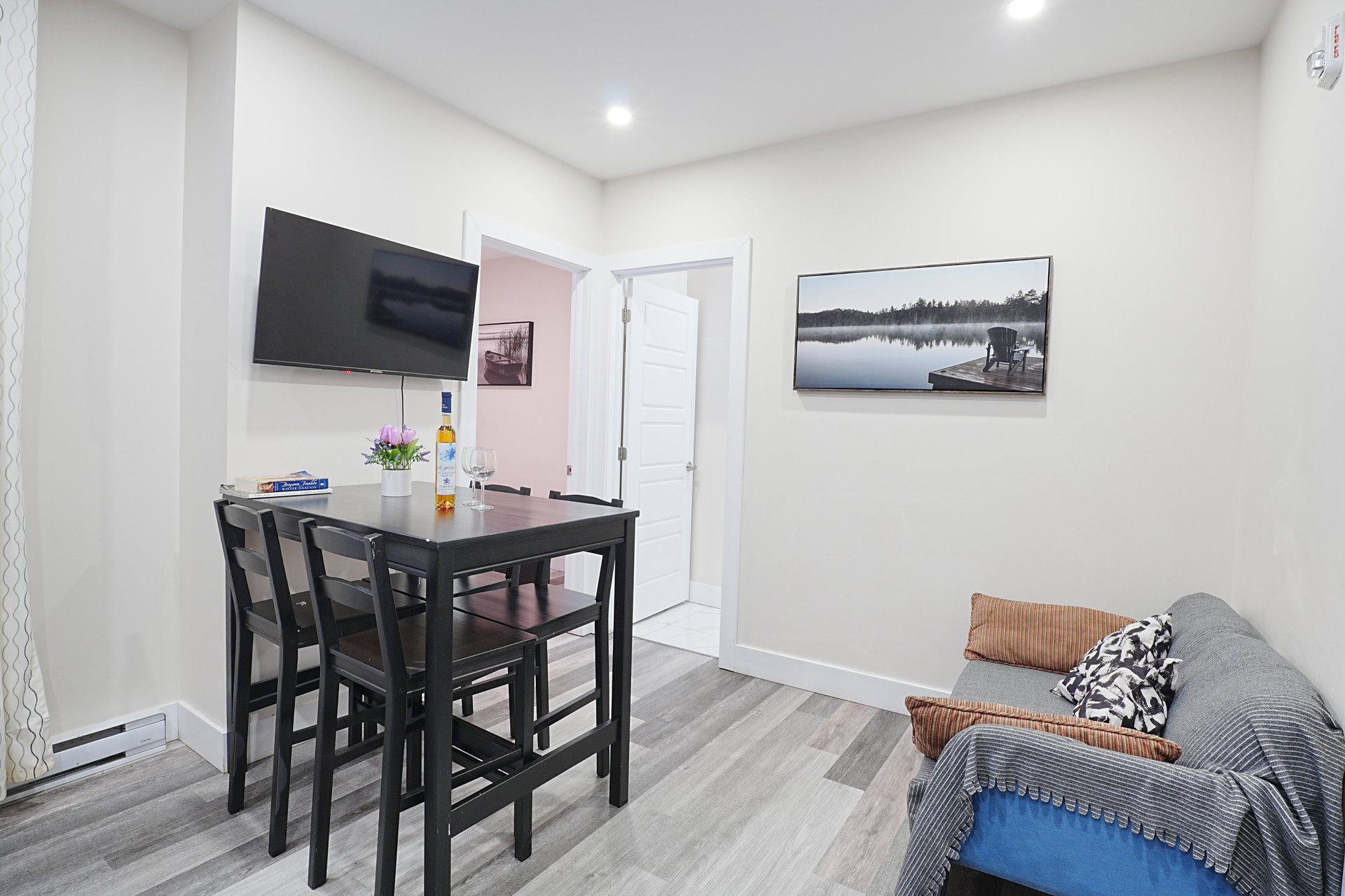 Dining area with wall art and sofa