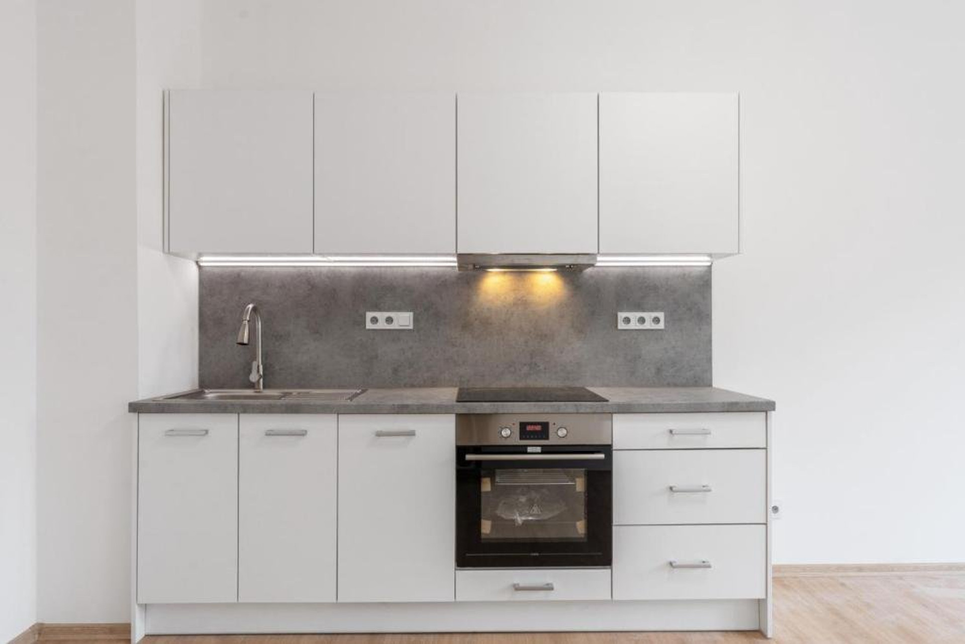 Modern white kitchen with oven