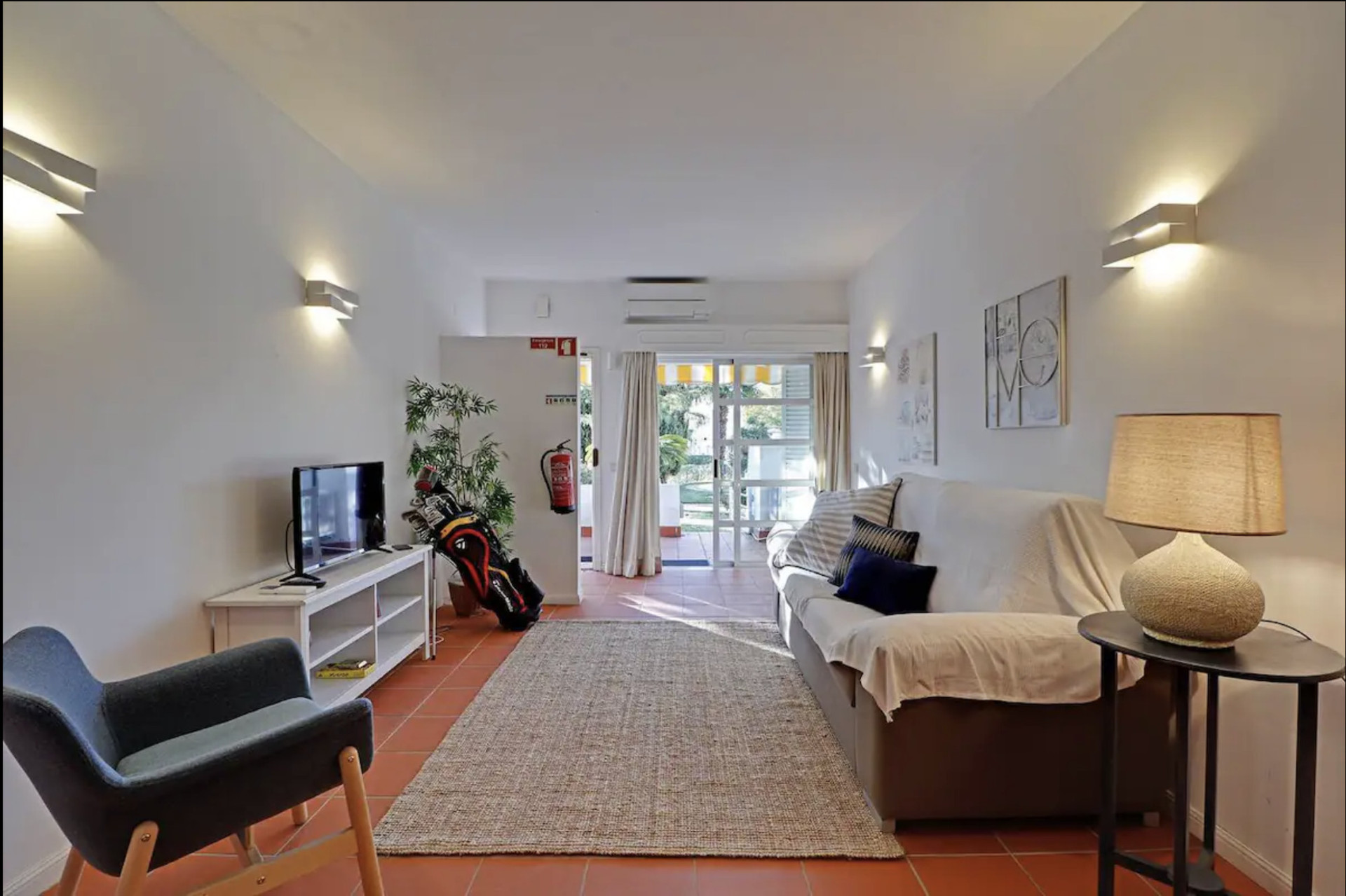 Living Room with a TV, Sofa, AC and Dining Table