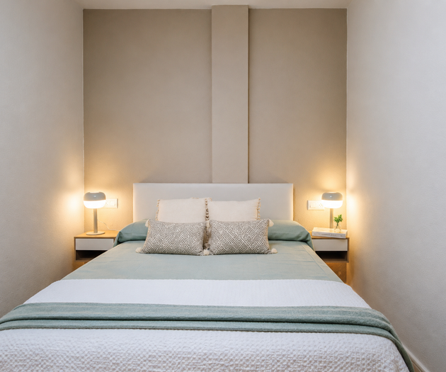 Cozy bedroom with twin lamps