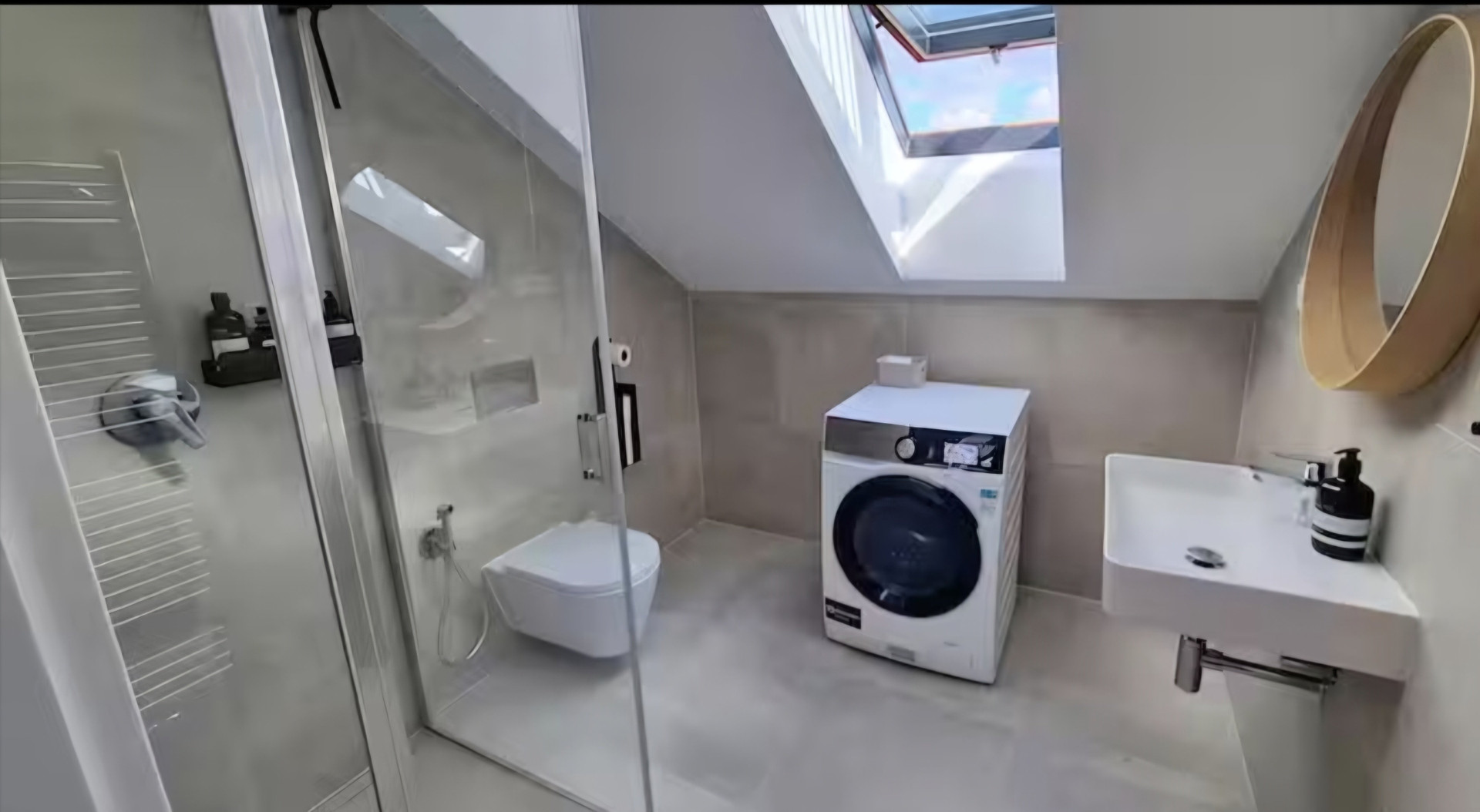 Bathroom with shower and washer