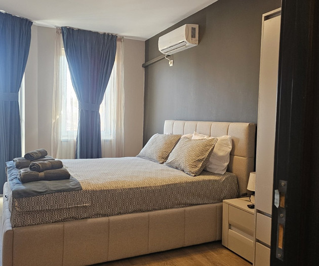 Bedroom with bed and curtains