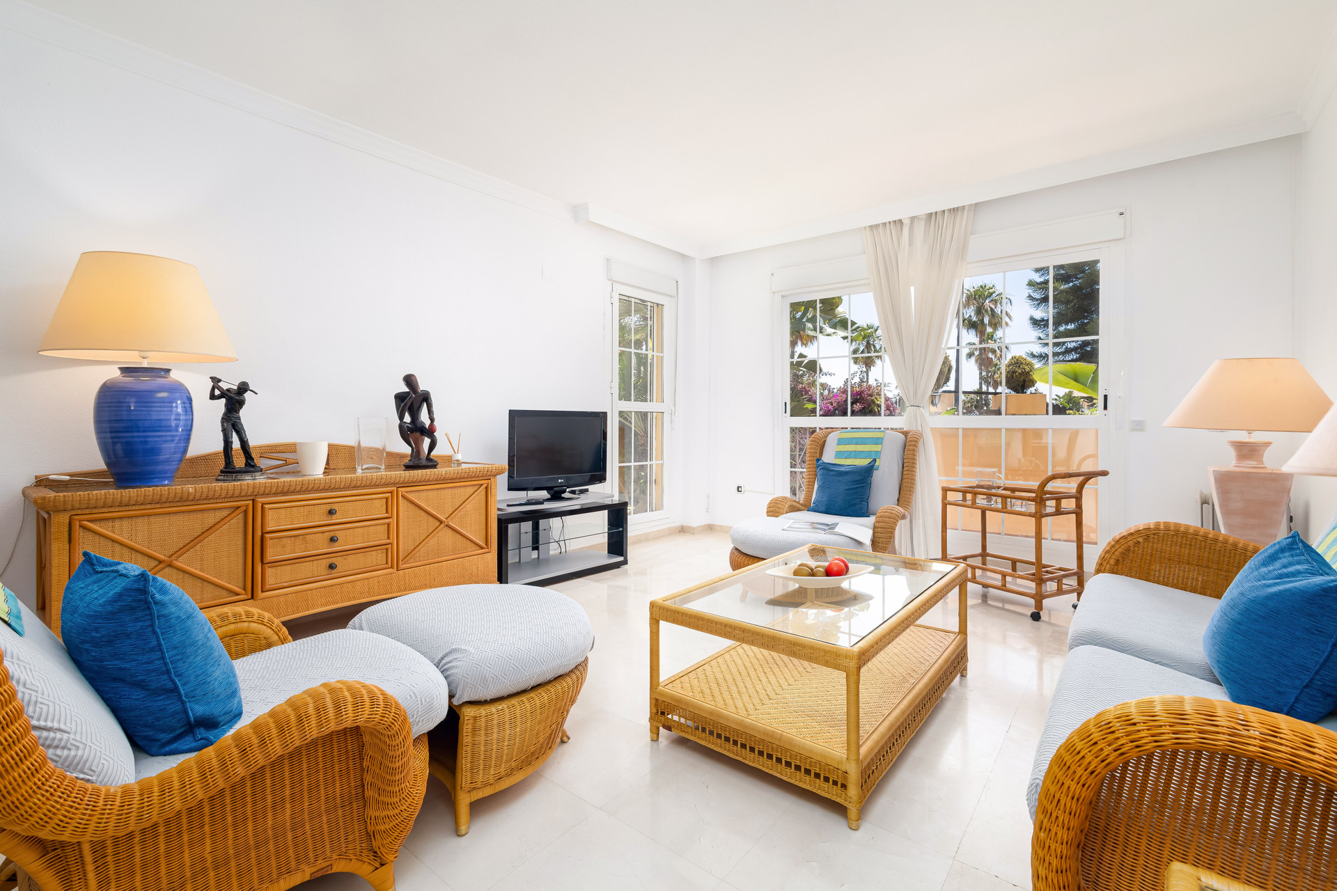 Bright living room with wicker furniture